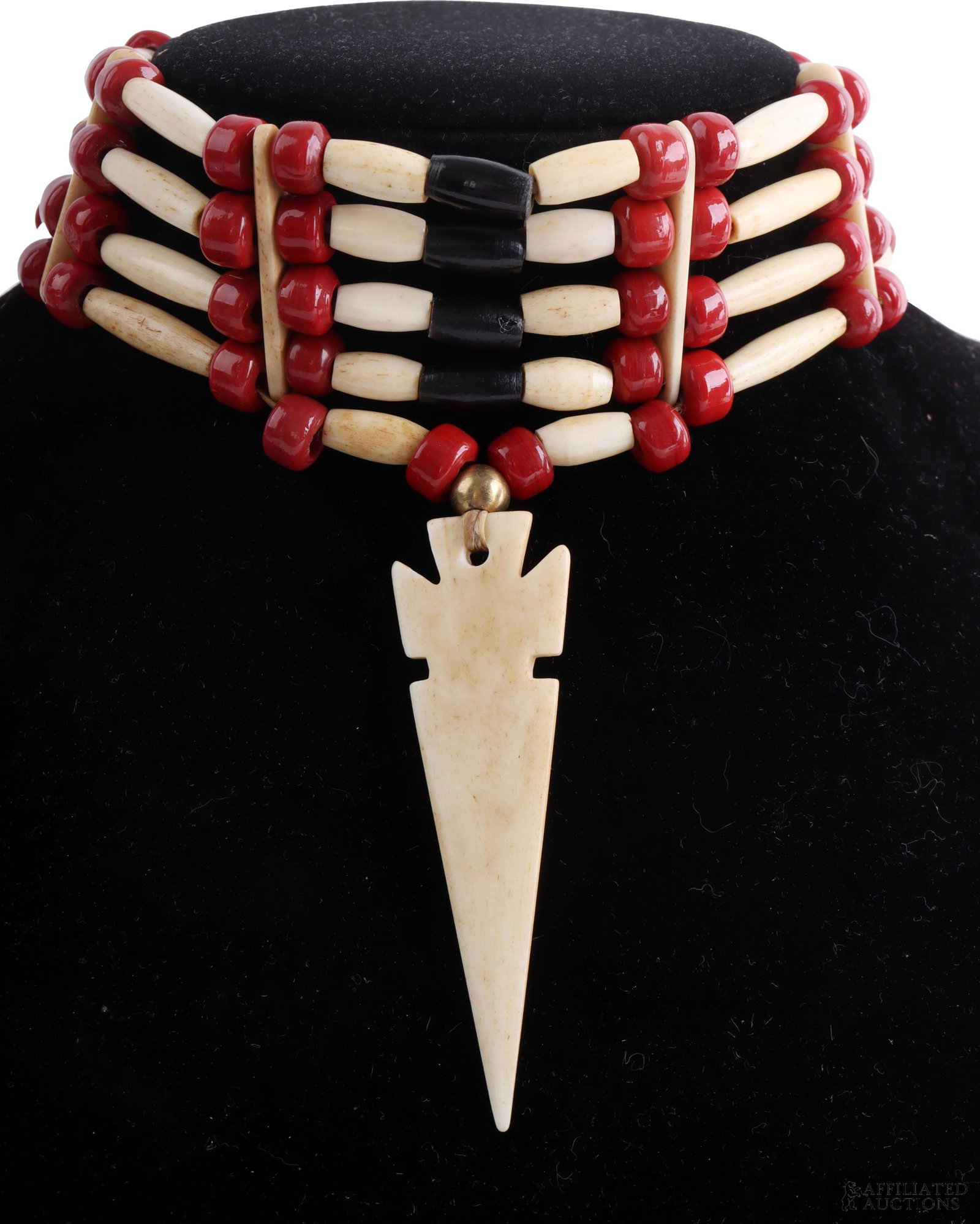 Native American Style Red and Black Beaded Choker: A four-row beaded choker composed of six sections per row, each section formed from one-inch bone hairpipe beads flanked by two red glass pony beads. The center section features two half-inch bone hai