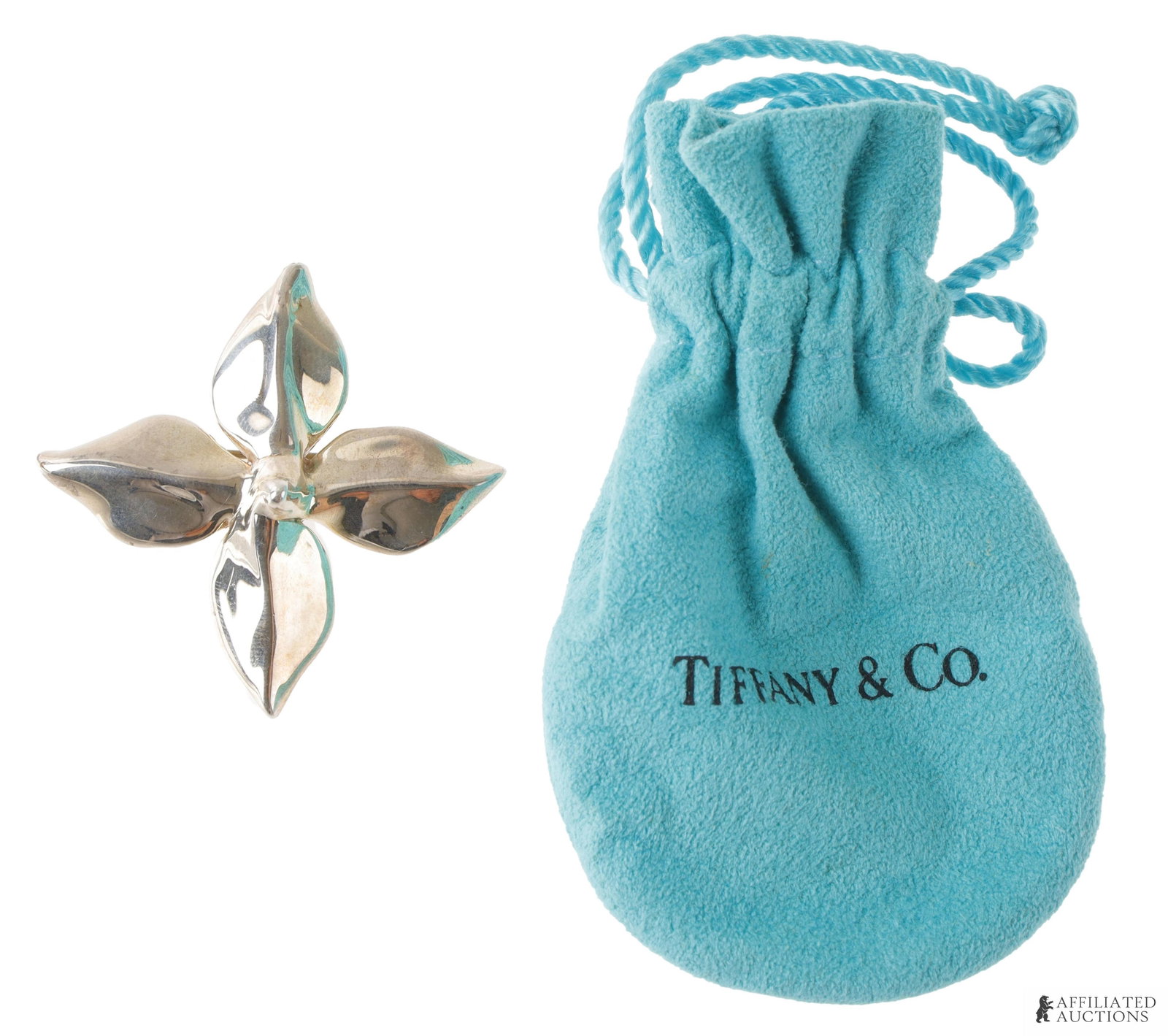 Tiffany & Co Poinsettia Silver Brooch: Marked "Tiffany & Co 925. It measures 46.61mm X 46mm. Comes with bag.