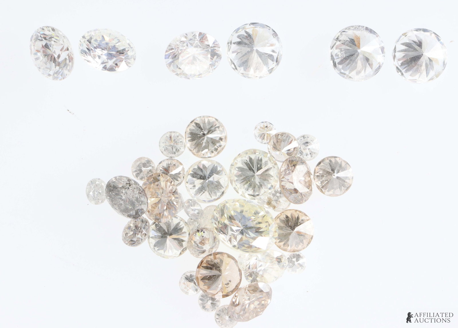 Reclaimed Diamonds 2.85 TCW with Matching Pairs: Reclaimed diamonds 2.85 TCW. Stones are a mix of round and princess cut. Color range is near colorless to champagne. Size is 0.31 ct to melee. Matching pairs, set 1 measures 0.175 ct 3.6x3.6x2.33 mm, 