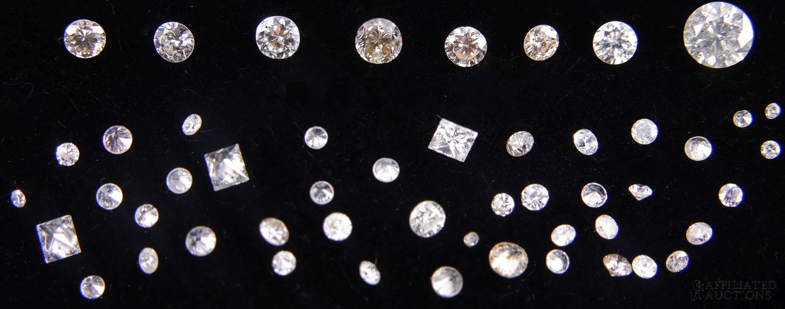 Reclaimed Diamonds 2.08 TCW: Reclaimed diamonds 2.085 TCW. Stones are a mix of round and princess cut. Size ranging from 0.365 ct to melee. Color is near colorless to light champagne. | This lot has a reserve.