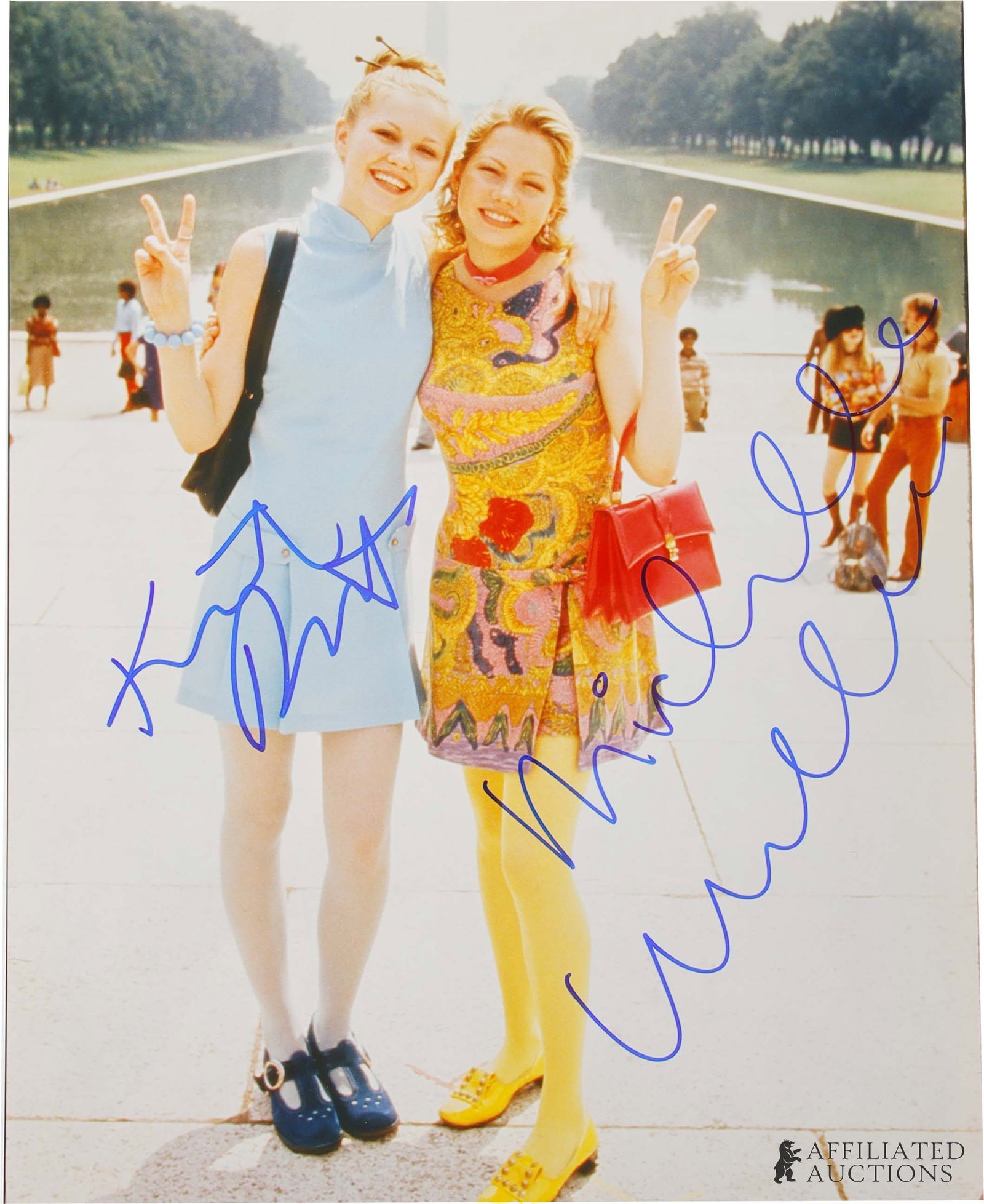 Kirsten Dunst Michelle Williams Autograph Dick: An autographed photograph from the 1999 political comedy Dick, hand-signed by lead co-stars Kirsten Dunst and Michelle Williams. Signatures acquired in person through direct collection by autograph