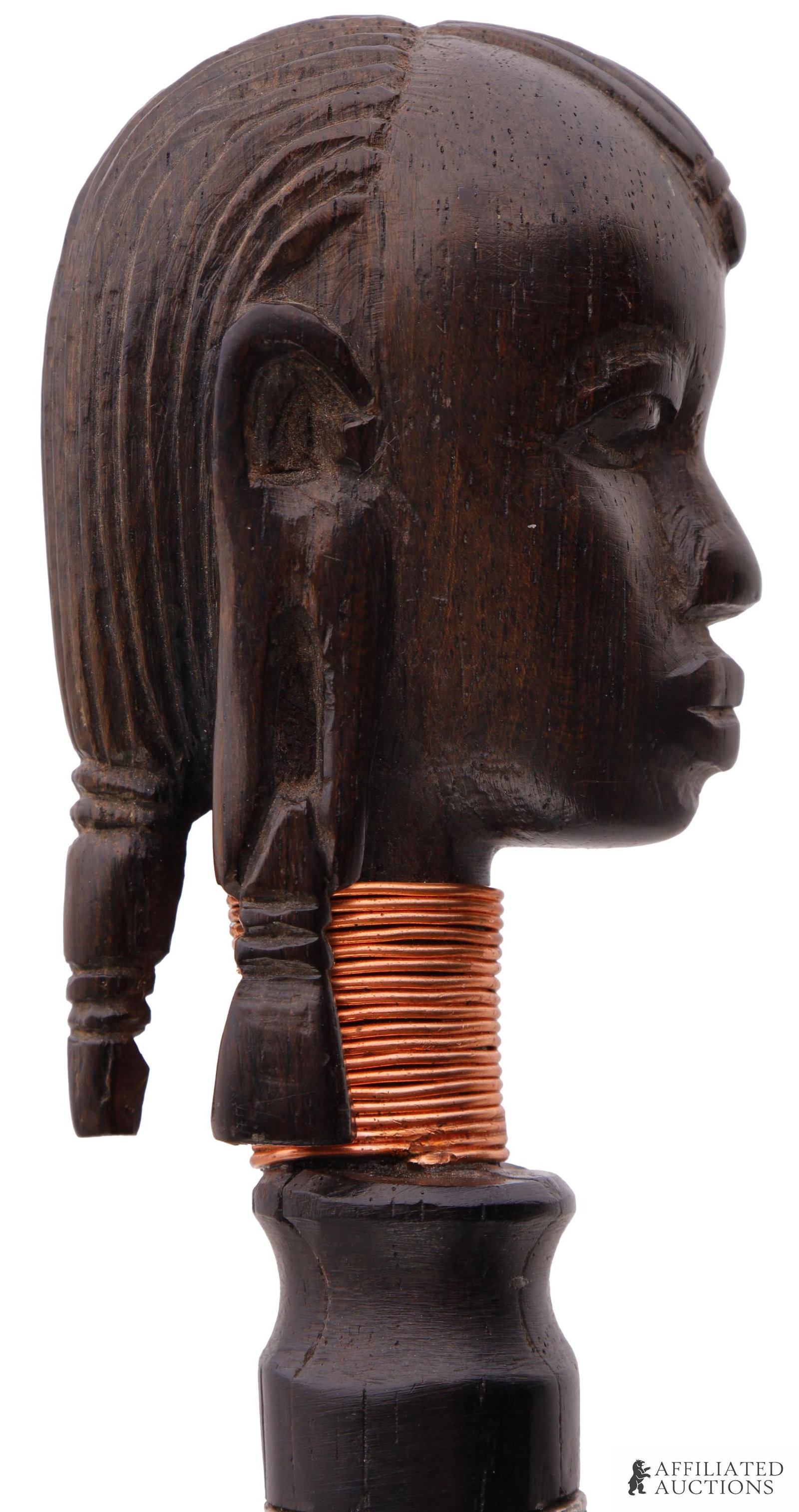 African Figural Walking Stick Cane: A walking stick with an African tribal figural knob. Dark wood, with a brass wire wrapping around the neck. 37 inches.