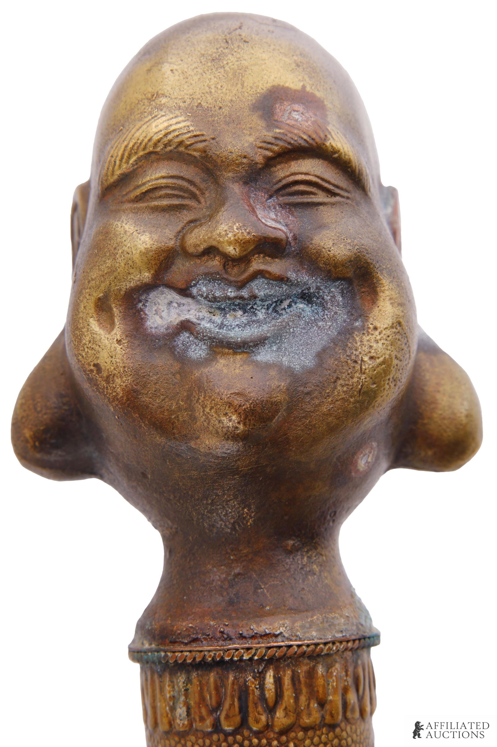Maitreya Laughing Budda Walking Stick Spike: A Maitreya or laughing Buddha head walking stick concealing an interior spike. Brass construction. Late nineteenth or early twentieth century construction. 34.75 inches in length. 13.5 inches.