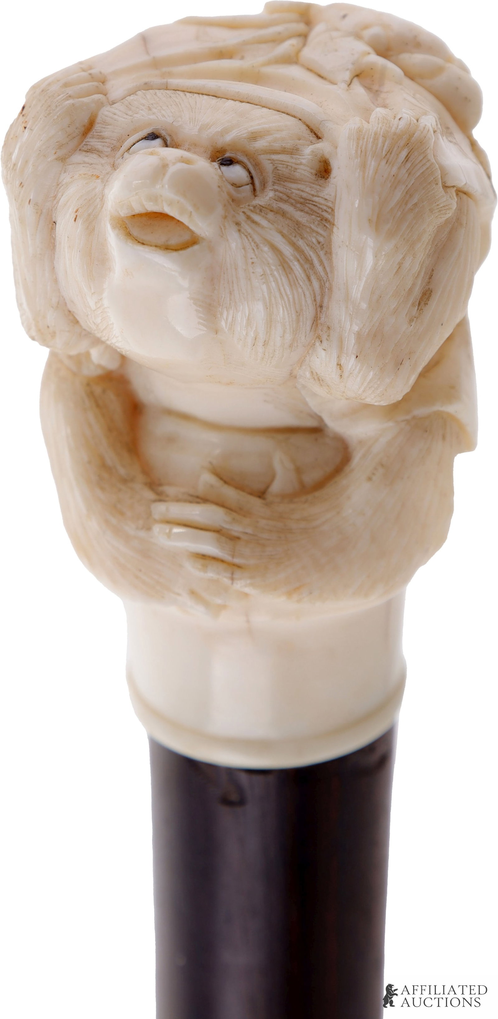 Monkey & Crab Netsuke Walking Stick Antique Ivory: An antique walking stick with a knob depicting a scene from the Japanese folk tale Monkey-Crab Battle, depicting cowering monkey under a robe or blanket, as a crab crawls up his back. Wooden stick, br