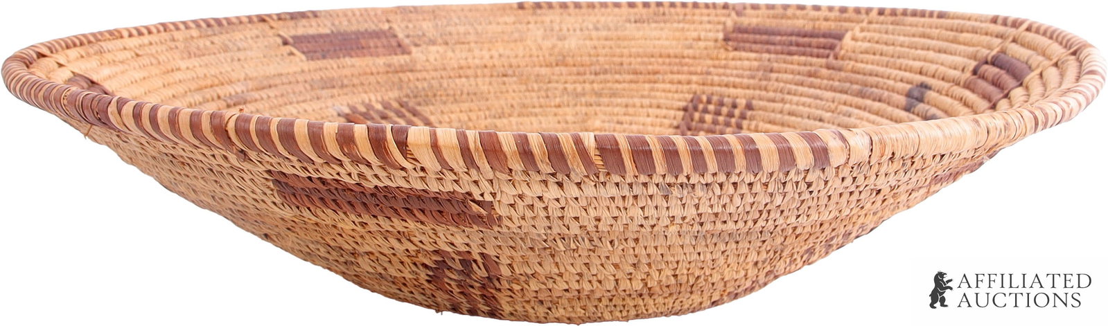 Southwest Native American Ceremonial Basket: A woven basket from the American Southwest, traditionally used in weddings or ceremonies. The specific construction of this basket suggests that is either Navajo or Pima. 14 inch diameter, approximate
