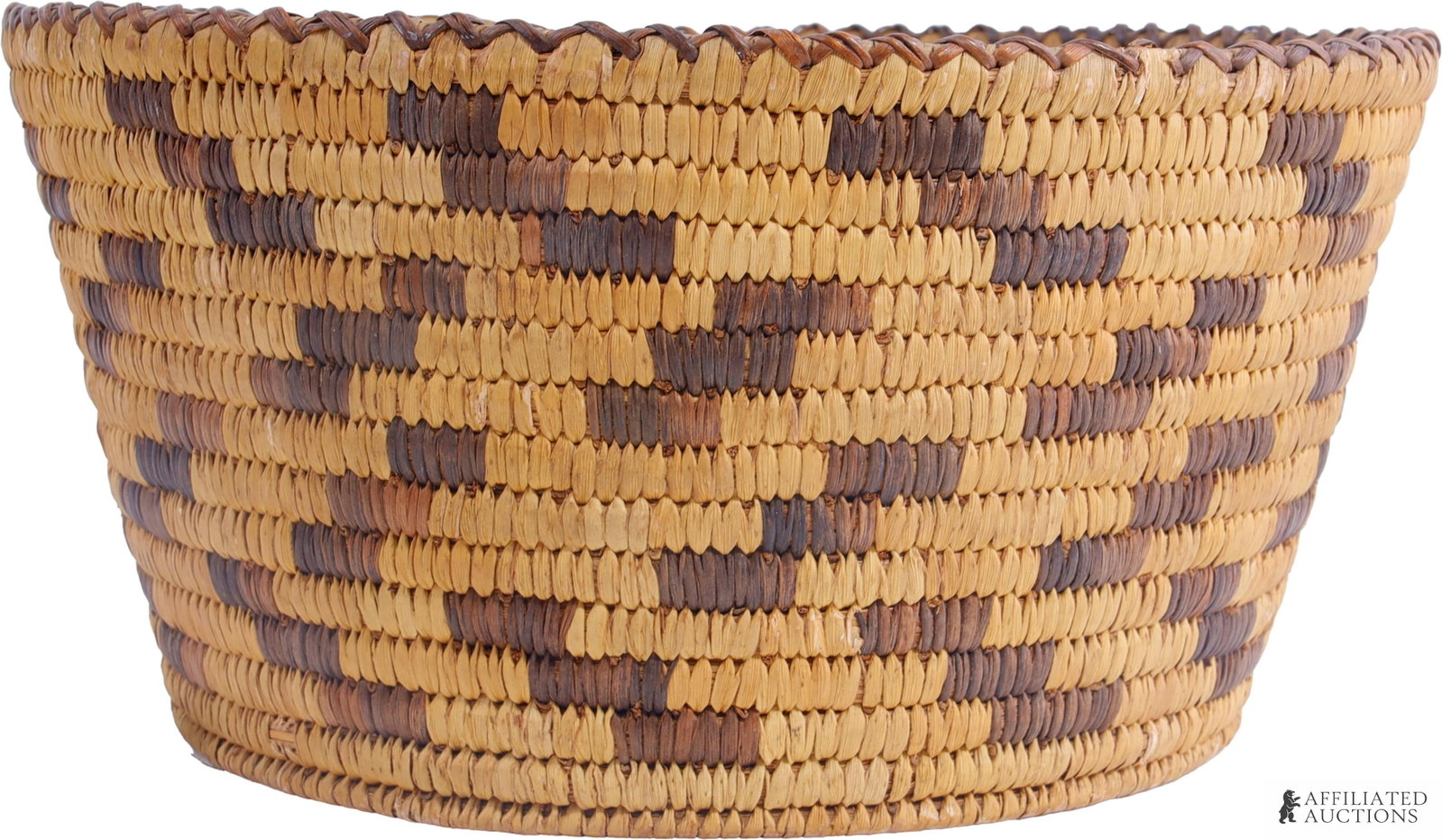 Southwest Native American Ceremonial Basket: A woven basket from the American Southwest, traditionally used in weddings or ceremonies. The specific construction of this basket suggests that is either Pima or Papago. 10.5 inch diameter, approxima