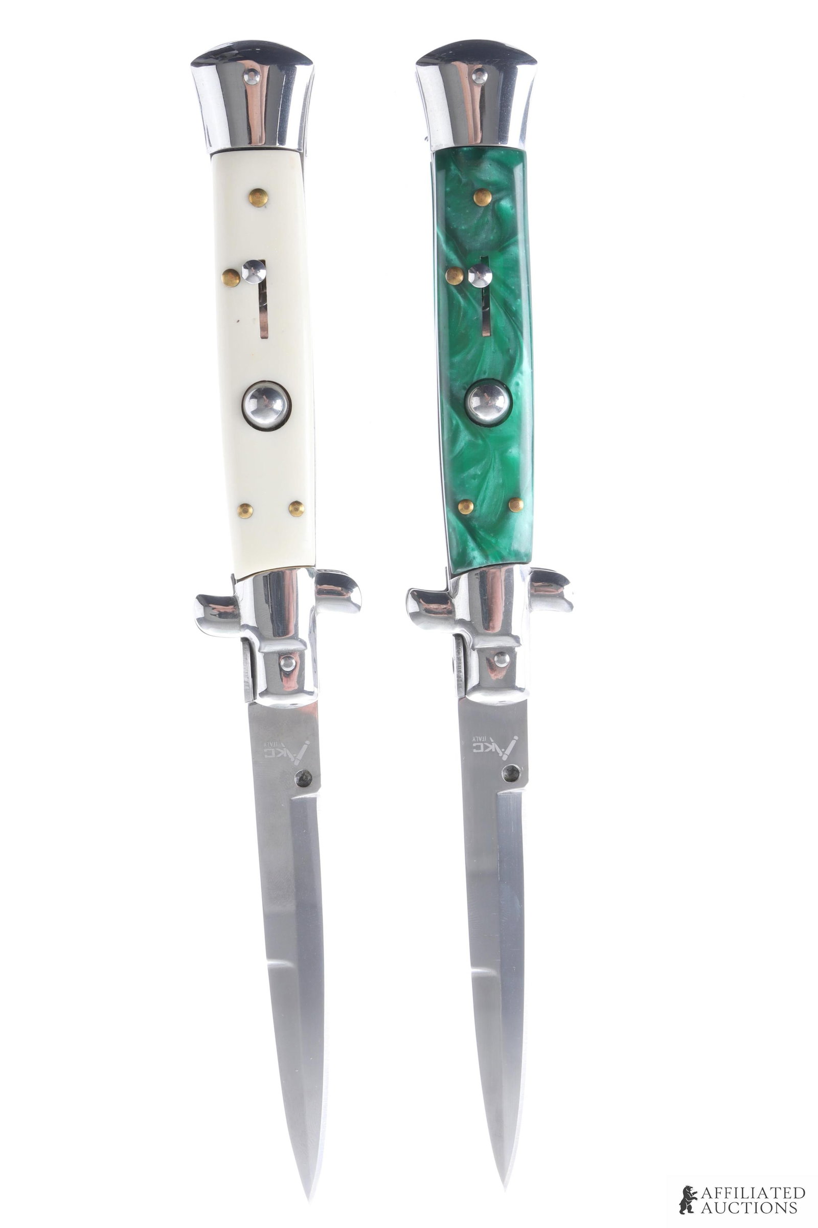 2 AKC 10 Inch Italian Switchblade Knife Lot: Lot of two AKC Italian-made switchblades. Knives measure 10 inches open, 5 1/2 inches closed. Blades are of stainless steel construction. One grip of celluloid construction, one of opalescent green pl