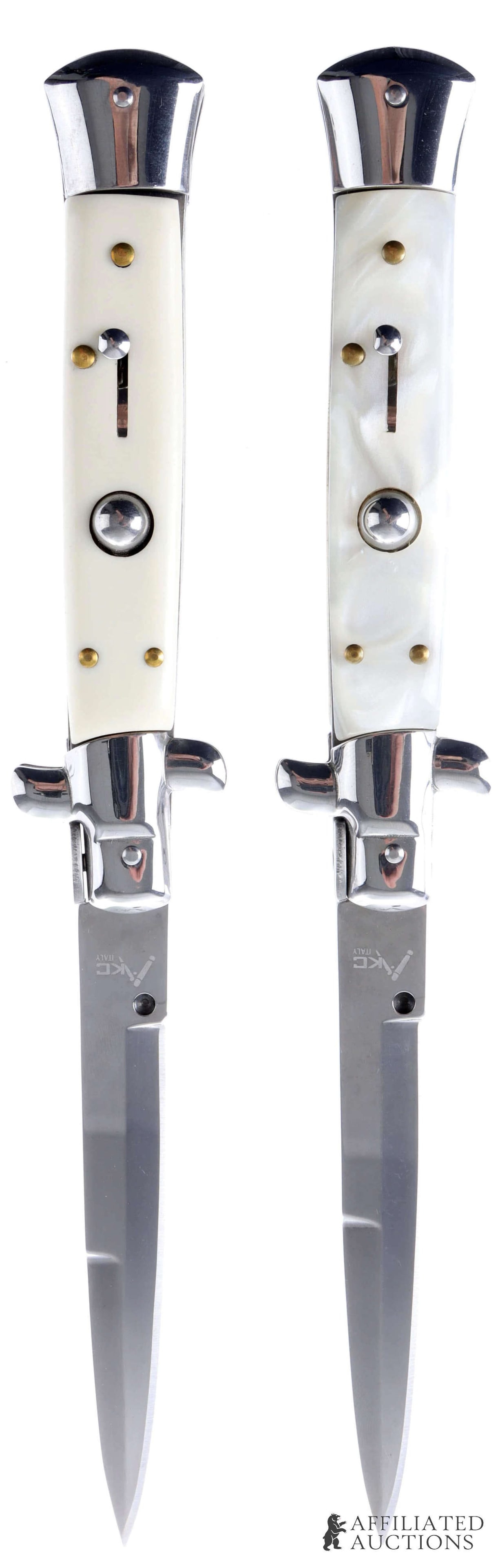 2 AKC 10 Inch Italian Switchblade Knife Lot: Lot of two AKC Italian-made switchblades. Knives measure 10 inches open, 5 1/2 inches closed. Blades are of stainless steel construction. One grip of celluloid construction, one of opalescent white pl