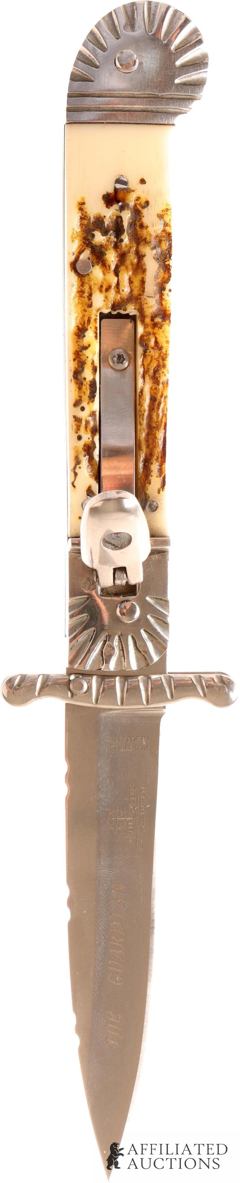 Hubertus The Guardian Switchblade Knife: Steel blade with simulated stag grips. Blade is engraved "The Guardian Hubertus Rostfrei Germany" It measures 8 1/8 inches. | This lot has a reserve.