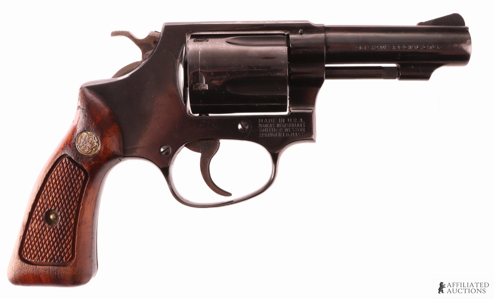 Smith & Wesson Model 36-1 .38 Spl Revolver: Smith & Wesson Model 36-1 "Chief's Special" double-action revolver with holster. Barrel length 3 inches. Capacity 5 rounds. Blued steel with wood grips. Fluted cylinder. FFL or C&R required for transf