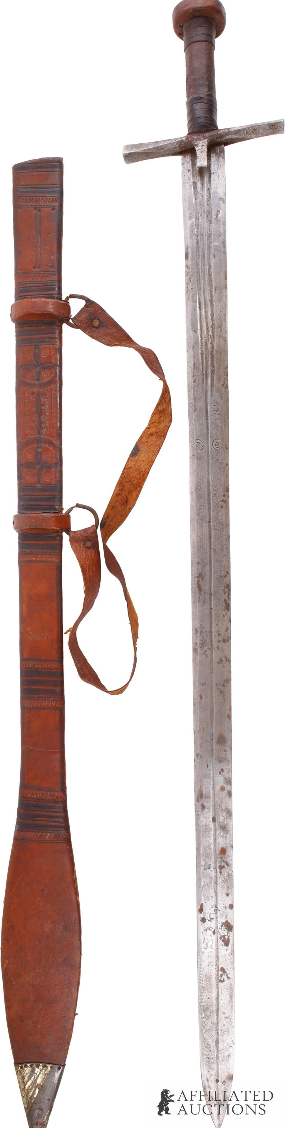 Mahdist Era Kaskara Sword Sudan Africa: A kaskara long sword, likely from the Mahdist era. Total length is 41 inches. With a leaf tipped scabbard.