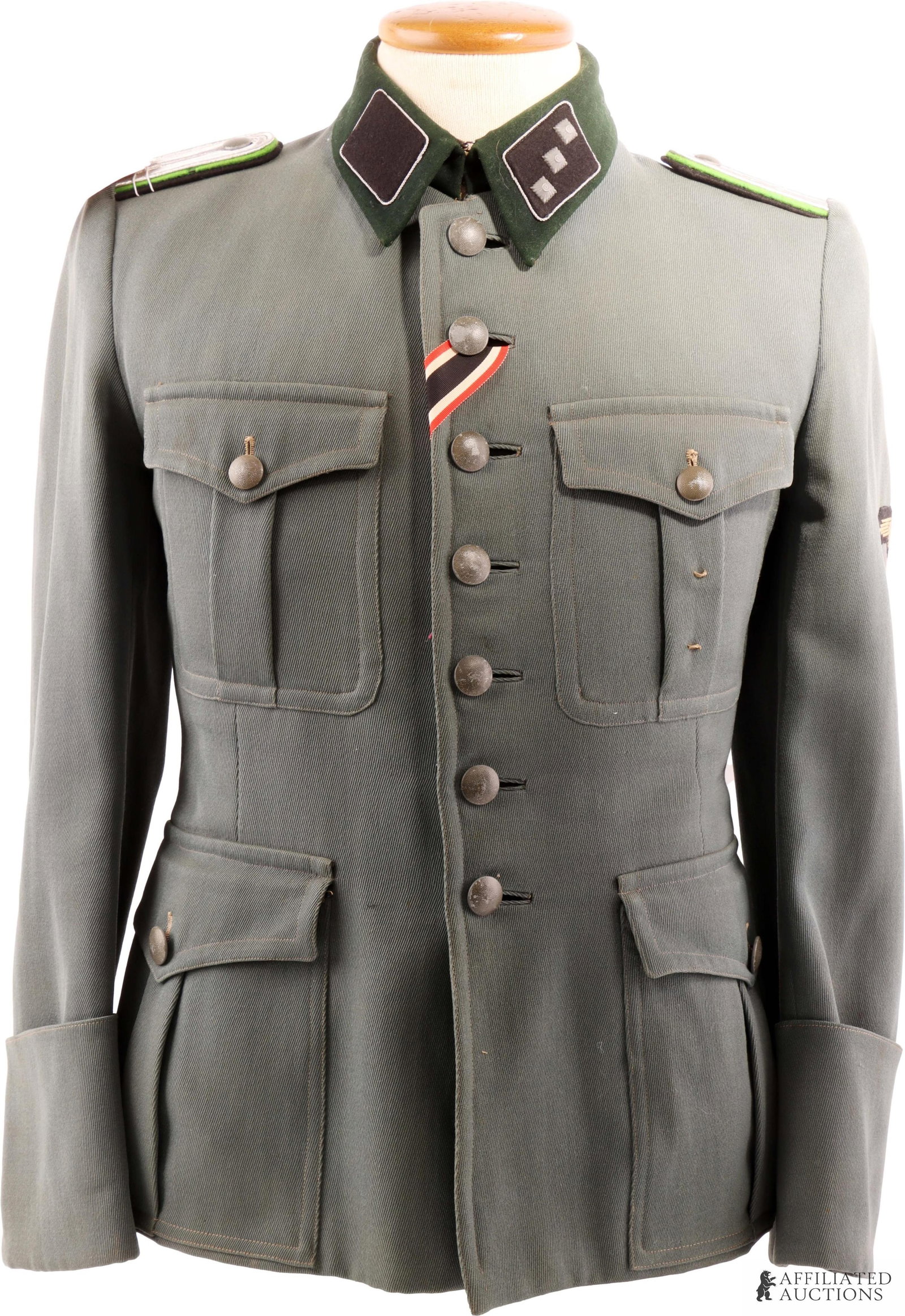 SD Security Police SS Tunic WWII German Reich: Dutch tailor and trikot material, early hammerhead sleeve eagle, and War Merit cross 2nd class ribbon. Dark green collar stitched onto tunic with a mix of machine and hand stitching. Shoulder boards w