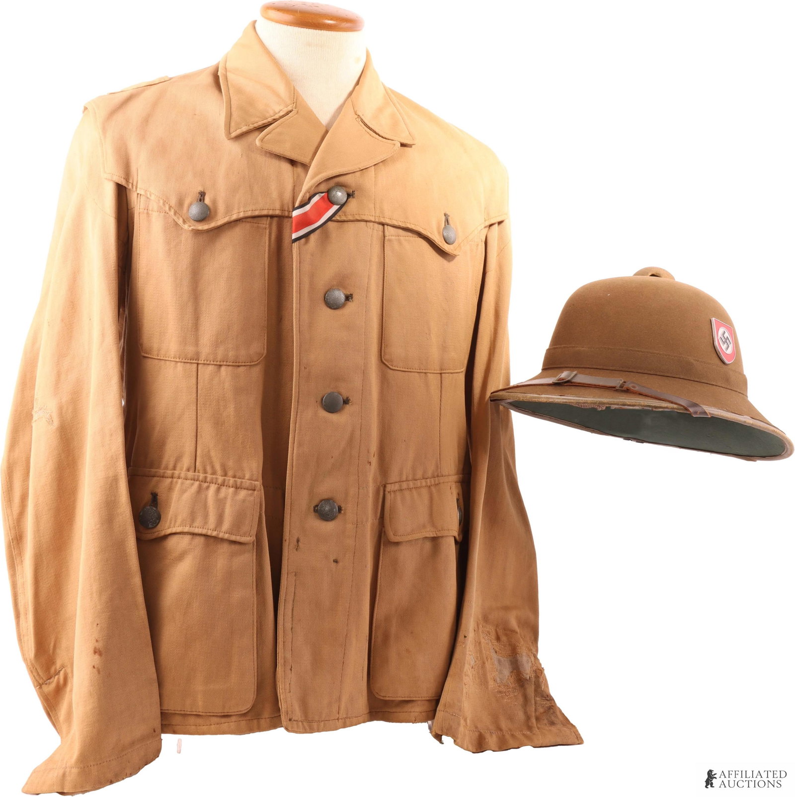 SS DAK Afrika Corps Summer Tunic and Pith: WWII German Afrikakorps SS Sahariana tunic. Features pebbled buttons. Iron Cross ribbon. Gold BeVo stitched eagle on left sleeve measuring 87mm. Size ink stamped 45, 44, 98, 72, 69. The pith features 