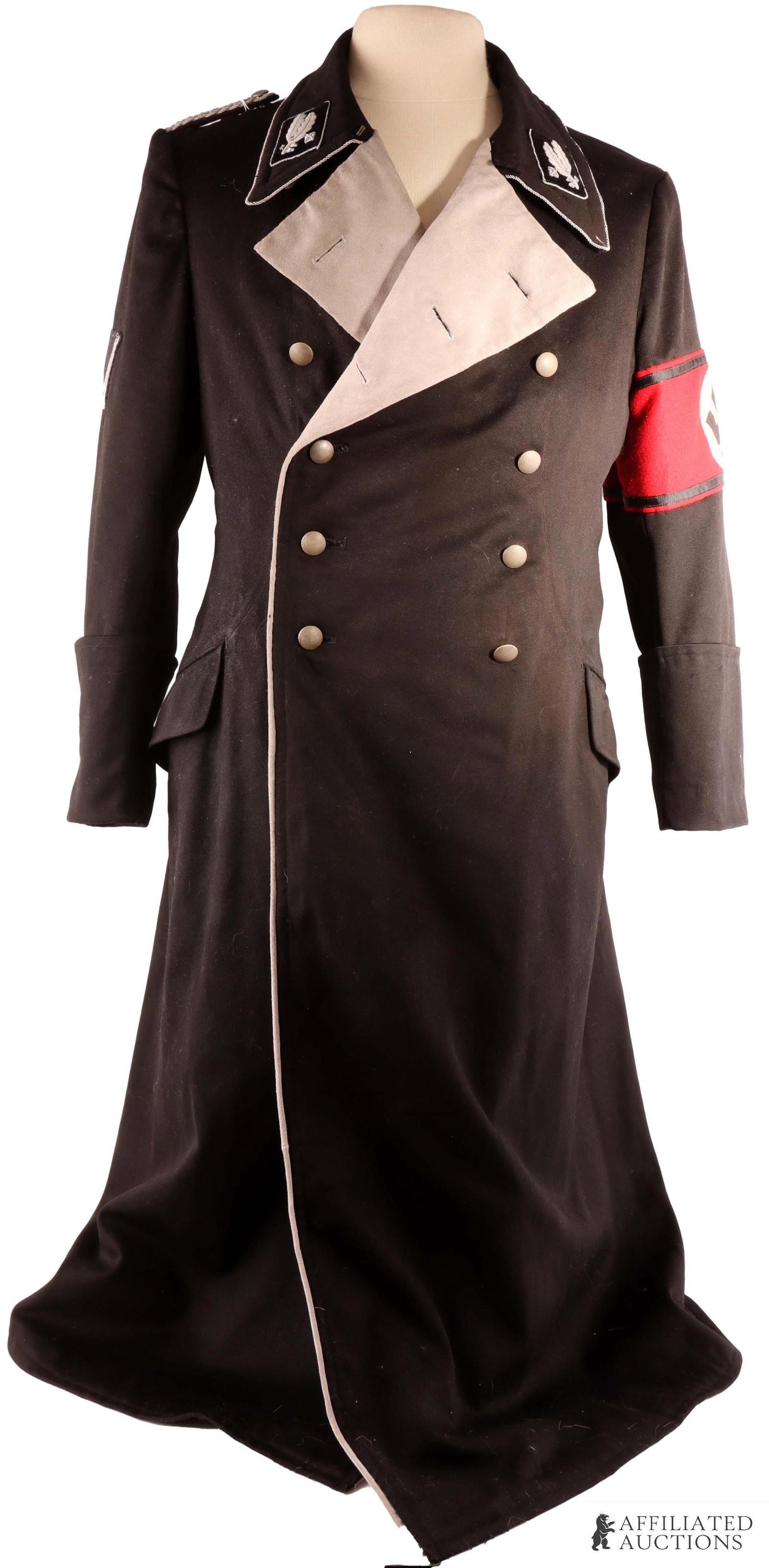 SS Oberfuhrer Overcoat WWII German Reich: Wool construction. Oberfuhrer collar tabs embroidered in silver bullion with border. They are hand stitched into the collar. One shoulder board on right shoulder in silver bullion and a pebbled button