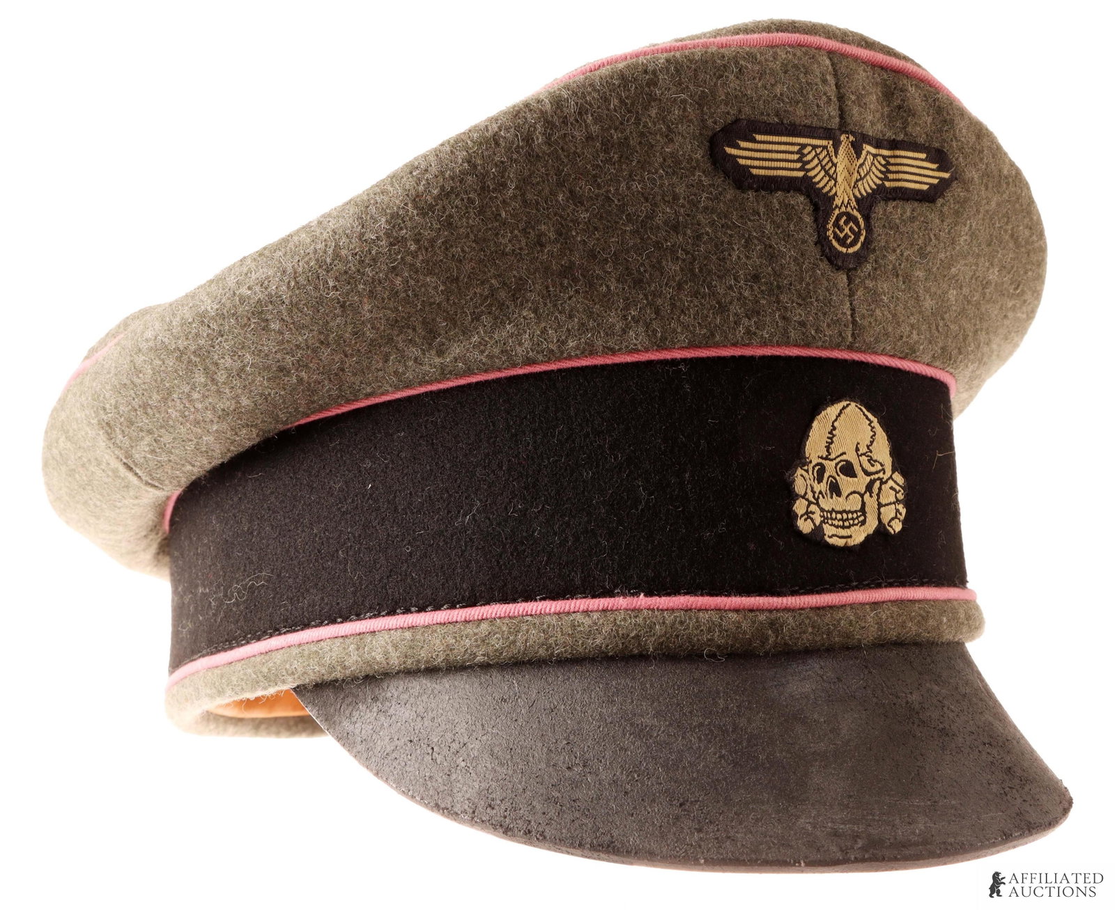 Waffen SS Panzer Officer Visor WWII German: Wool construction. Exterior features pink piping for Panzer. Two front Reichsadler and totenkopf patches, BeVo construction. Visor is leather with pink underside. Size 60 | This lot has a reserve.