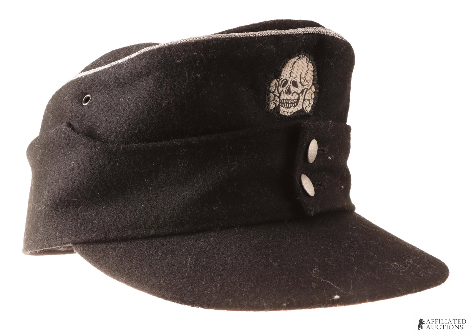 SS Officer M43 Field Cap WWII German: Black doe skin wool visor. Exterior features silver bullion piping, BeVo reichsadler and totenkopf, and pebbled buttons. Interior stamped 58 for size, dated 1943, and includes maker mark. Unauthentica