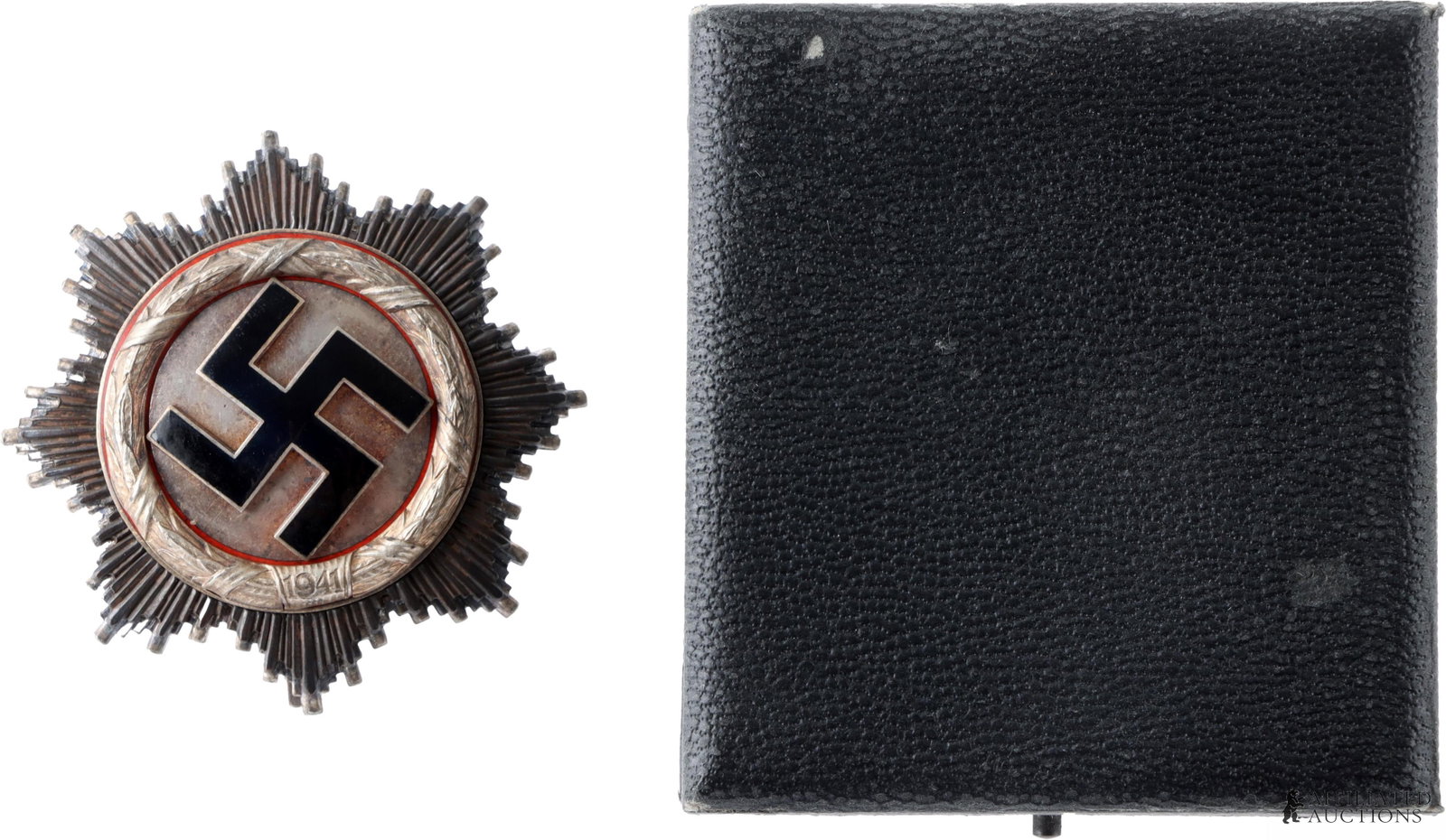 Cased WWII German Cross In Silver: WWII German Cross in Silver. Multipiece construction. 7 rivet type with larger center rivet. It measures 62.75mm. Comes in case. | This lot has a reserve.