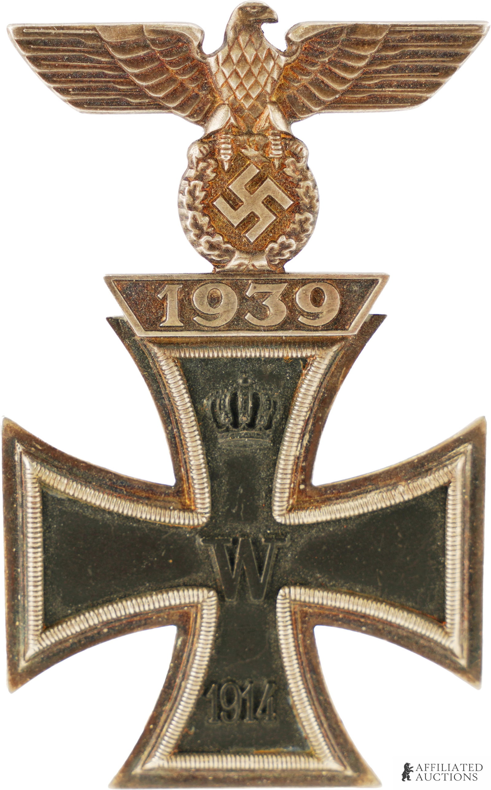 Imperial German Iron Cross First Class 1939 Spange: Multi-piece silvered frame with magnetic iron core. Non-hinge type spange. Screwback pin. No maker's marks. Measures 2 7/8 inches. | This lot has a reserve.