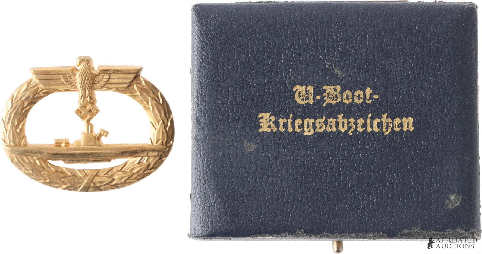 Cased Kriegsmarine U Boat Badge WWII German: WWII German Third Reich Kriegsmarine U-Boat badge in case. Standard brass gilt badge. W. Deumer make. It measures 50.3mm. Horizontal pin. Case has been modified to fit this badge. | This lot has a
