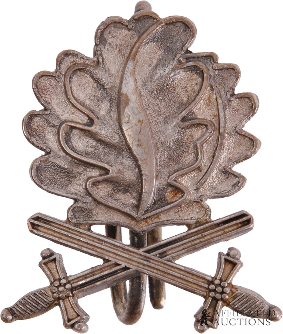 Iron Cross Oak Leaf Clasp with Swords WWII German: WWII German Oak Leaves with Crossing Swords clasp. Marked 900 for silver purity. Also marked L/50 for Gebruder Godet of Berlin. It measures 29mm. | This lot has a reserve.