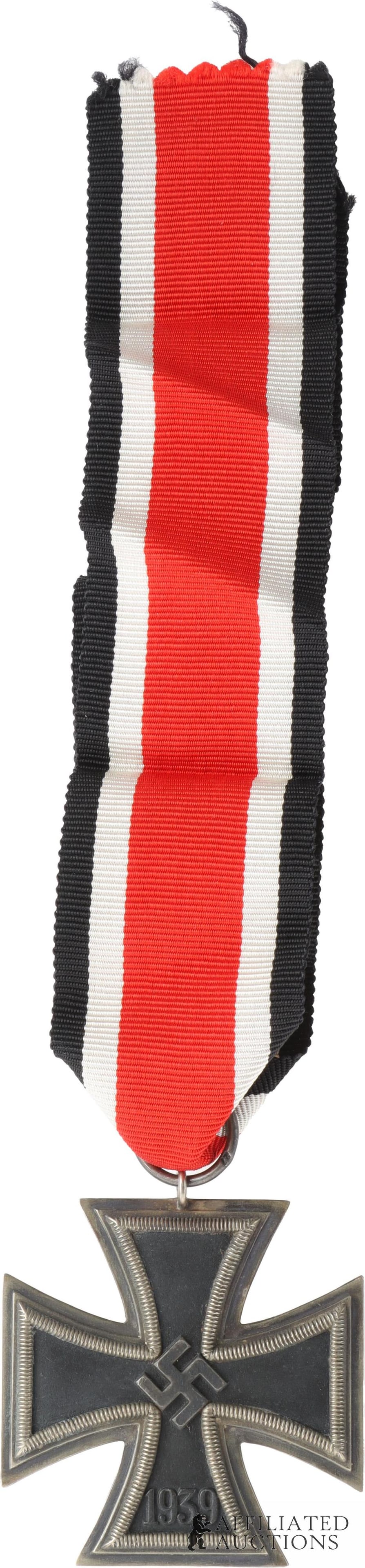 Iron Cross Second Class WWII German: WWII German Reich Iron Cross 2nd Class. Two piece frame with magnetic iron core. Lacquered finish. It measures 44mm. Ribbon ring stamped 27 for rare maker Anton Schenkls. | This lot has a reserve.