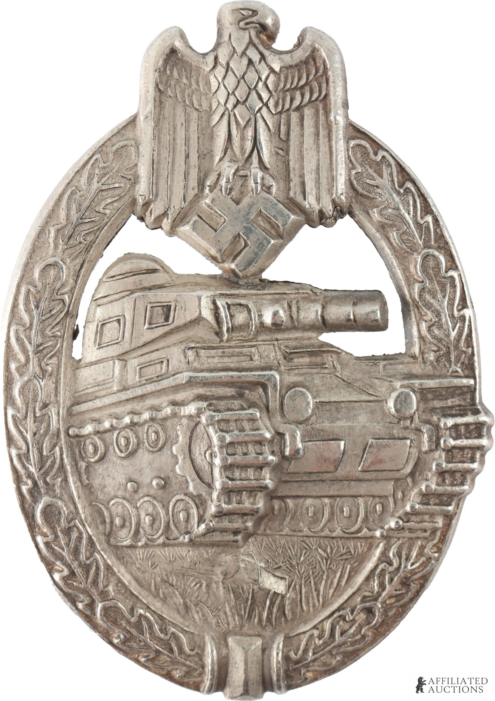 Panzer Assault Badge WWII German Reich: WWII German Reich Panzer Assault Badge in silver by Hermann Aurich. Early heavy type. It measures 60.24mm. | This lot has a reserve.