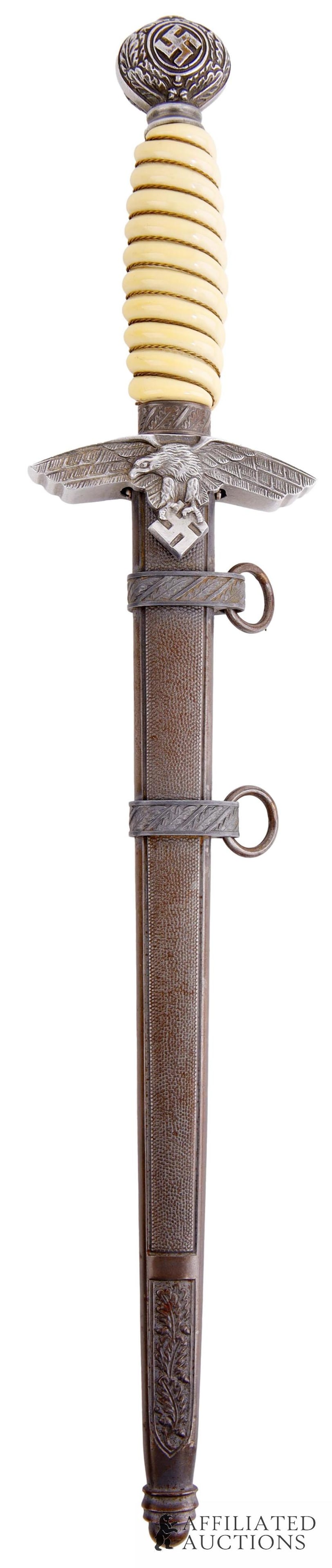 Luftwaffe 2nd Model Officer's Dagger with Scabbard: WWII German Luftwaffe Officer's Dagger, Second Model, with scabbard. Nickel-plated steel blade. Retains leather washer at base of blade. Wire-wrapped celluloid grip with aluminum cross guard and