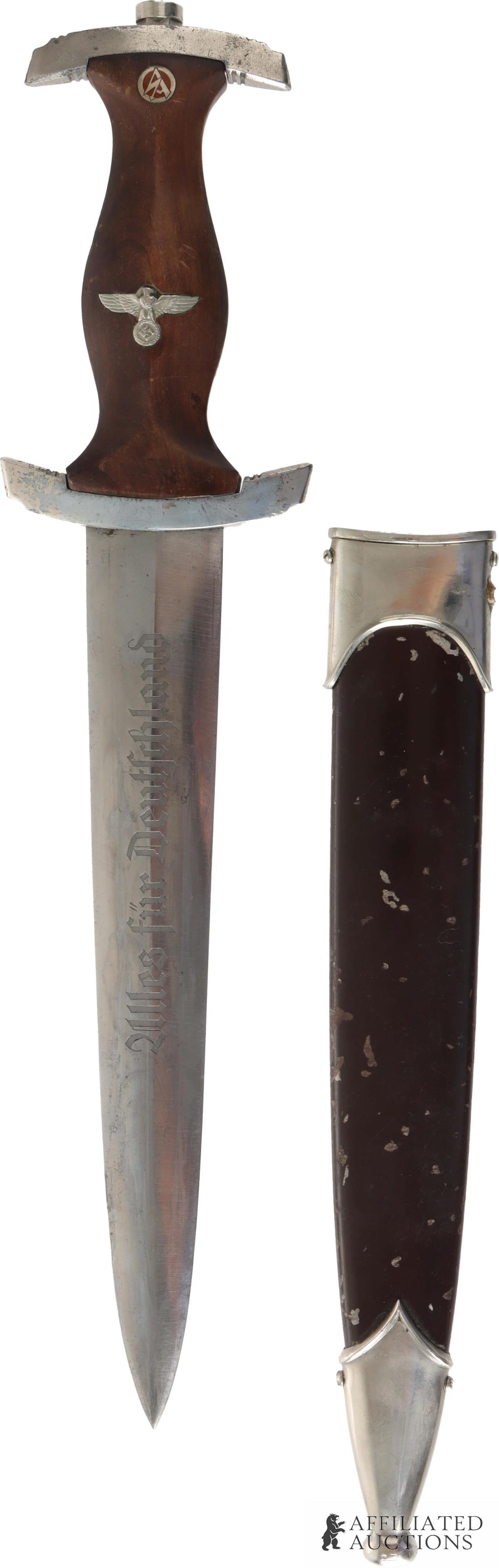 SA NSDAP Dagger Evertz WWII German Reich: WWII NSDAP Sa dagger. Acid etched SA motto. Reverse acid etched RZM M7/85 for Artur Evertz. Wood grip with inlaid SA runes and reichsadler. Nickel plated cast zinc crossguards. Housed in anodized