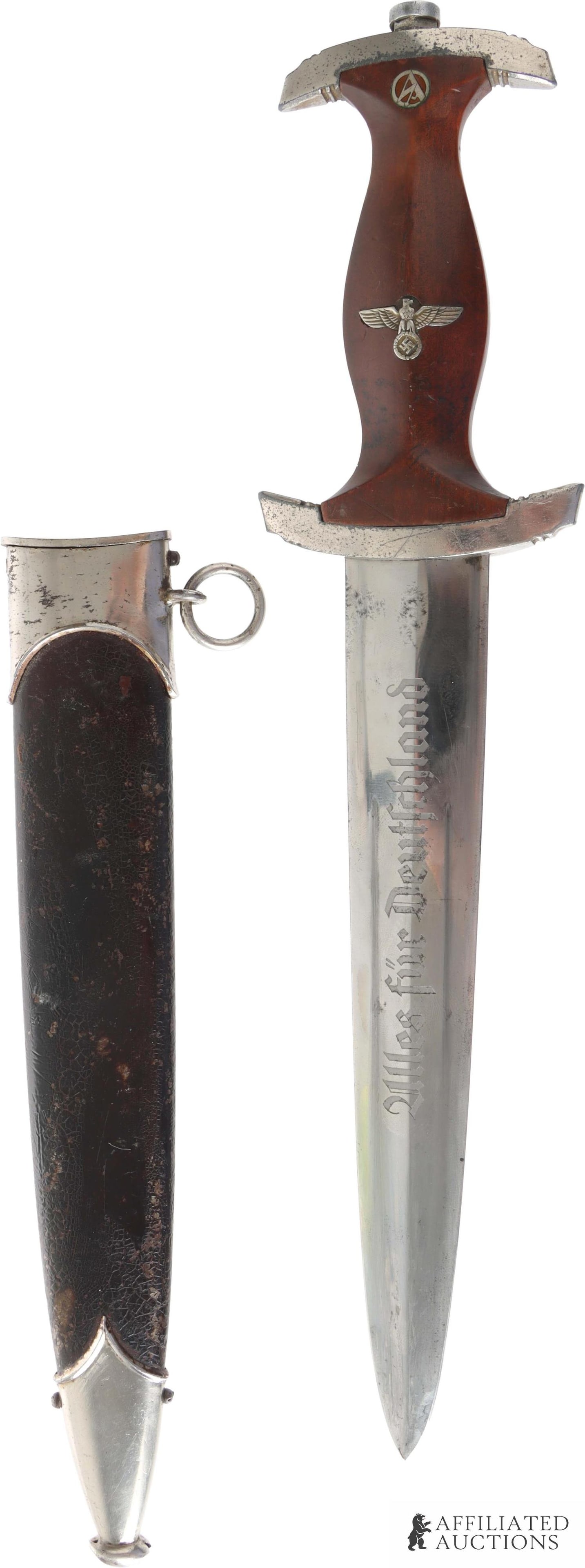 SA NSDAP Dagger Bocker WWII German Reich: Nickel plated steel blade. Acid etched SA motto. Reverse features acid etched "RZM M7/45" for Karl Bocker. Grip is wood with inlaid reichsadler and SA runes. Crossguards are cast zinc with nickel plat