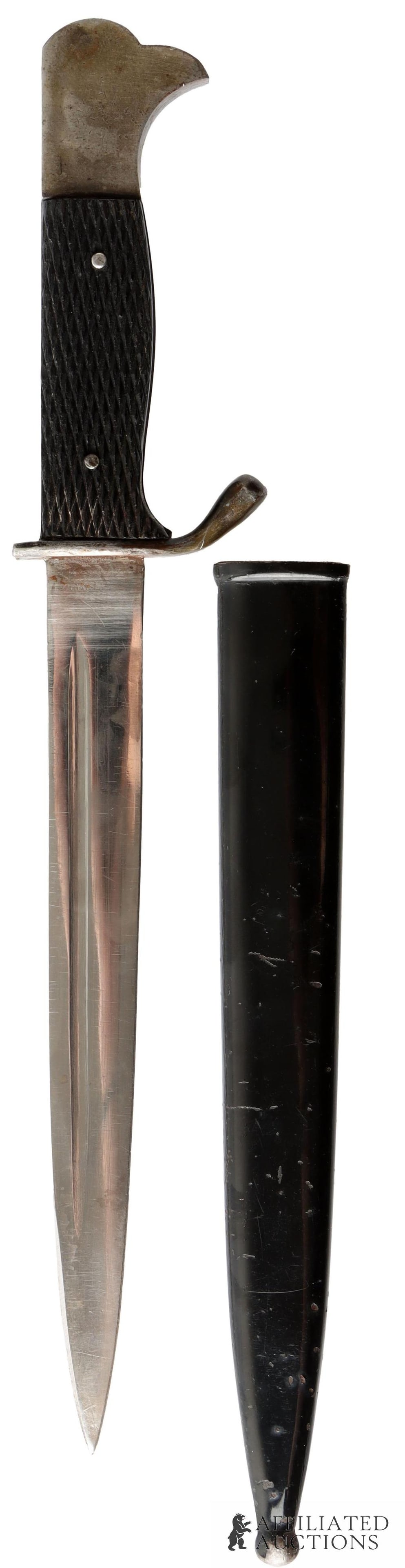 Miniature K98 Bayonet WWII German: Nickel plated steel blade, nickel pommel, nickel finger guard. Housed in anodized steel scabbard. It measure 9 1/4 inches. | This lot has a reserve.