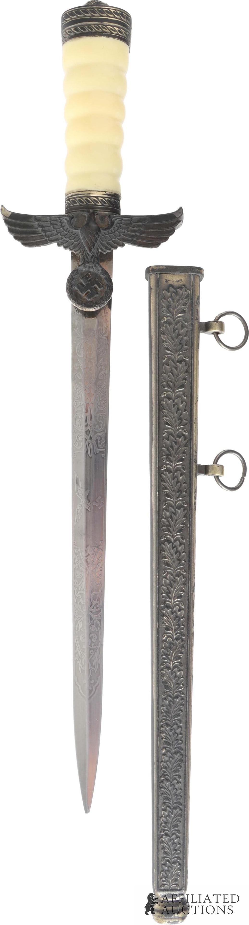 Hermann Goring Industrial Dagger WWII German: A replica of the Goring Industrial Dagger, presented to Goring by senior Third Reich leadership as a unique piece. Etched blade. Large Reichsadler on guard, Turk's knot on pommel, and synthetic
