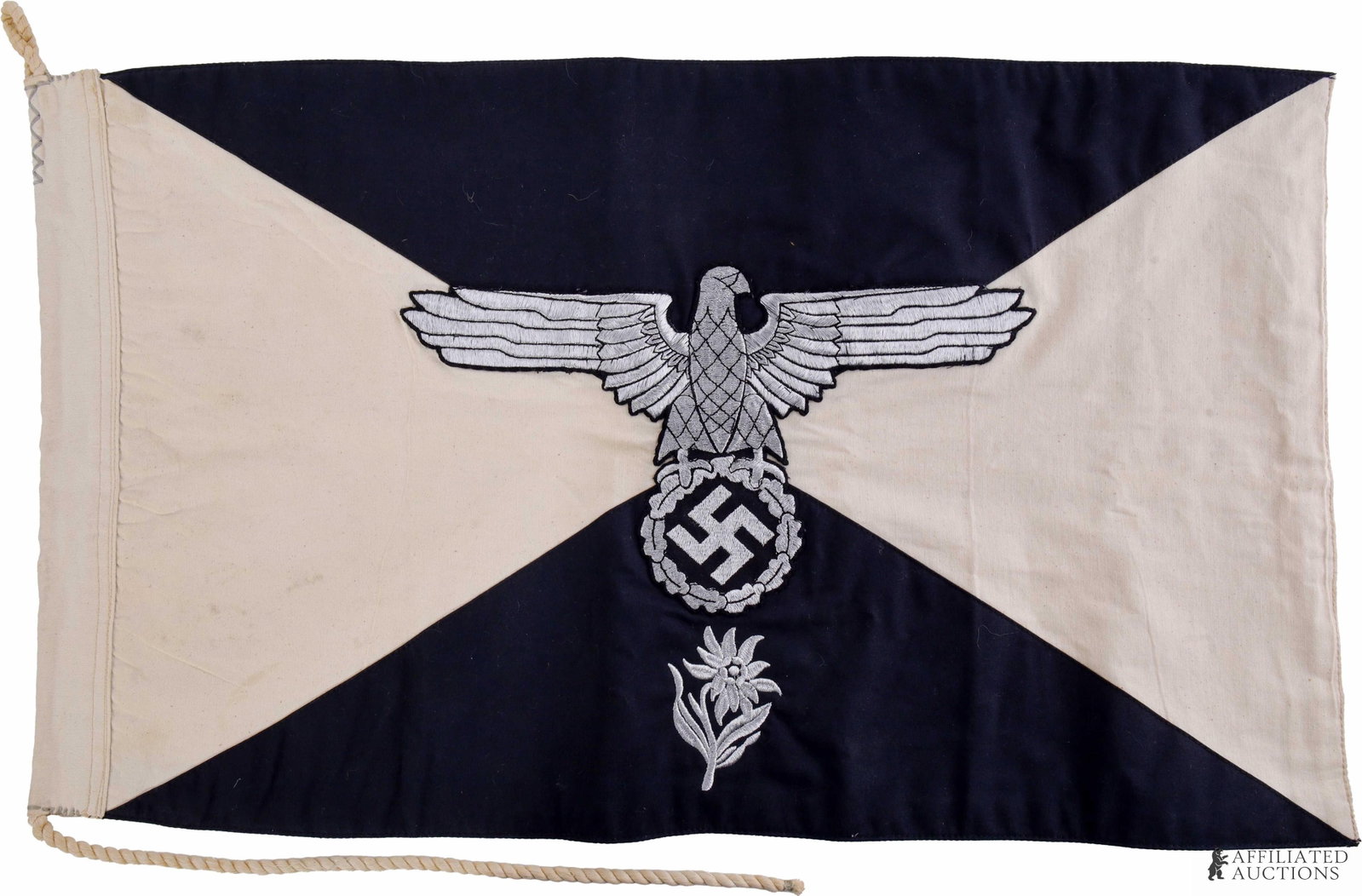 SS Mountain Troop Regimental Flag WWII German: Multi-piece cotton cloth construction. Flat wire embroidered eagle and edelweiss. It measures approximately 25 X 15 inches approximately. | This lot has a reserve.