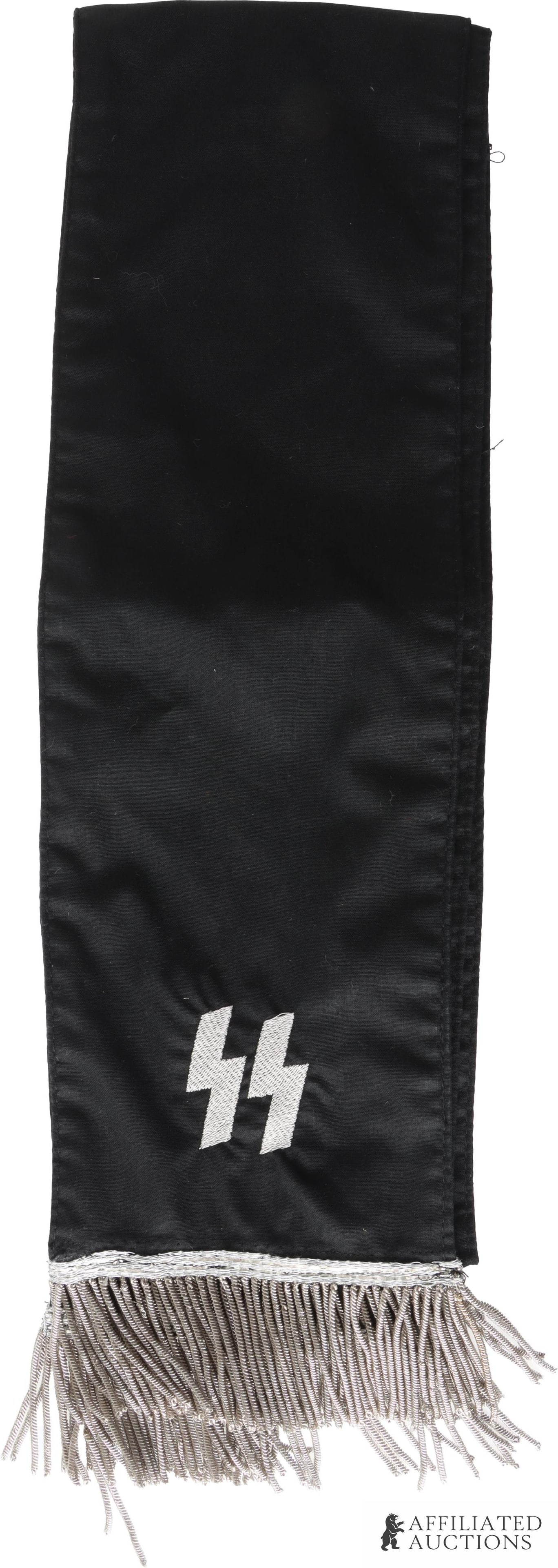 SS Funeral Sash WWII German Reich: Single sided with embroidered SS runes, Der Reichsfuhrer SS, and silver bullion fringe. Cloth construction. It measures 35 inches approximately. | This lot has a reserve.