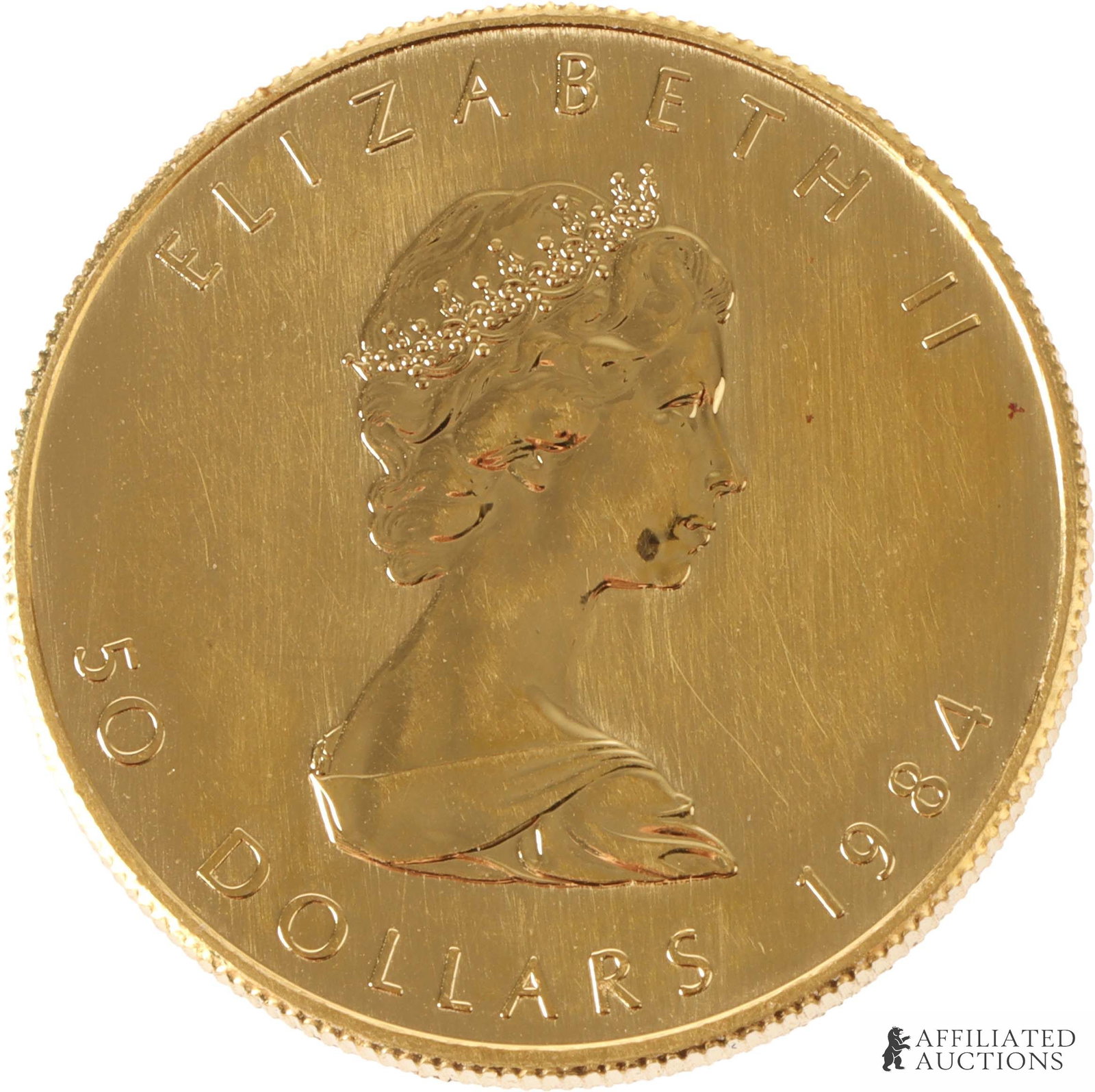 1 OZT Pure .999 Gold Maple Coin 1984: A 1984 Canadian $50 coin, featuring a bust of Queen Elizabeth II and the image of a maple leaf. Contains 1 ounce troy of gold. Metal: .999 gold Country of Origin: Canada Year Minted: 1984. | This lot 
