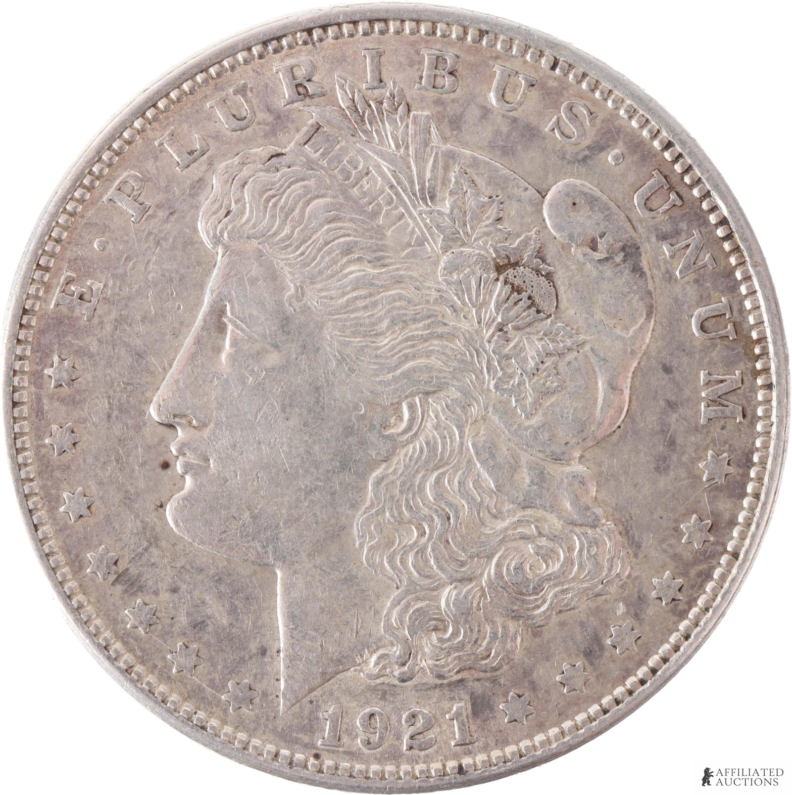 1921-D Silver Morgan Dollar Lightly Circulated: A lightly-circulated 1921-D silver Morgan dollar. Etchings and inscriptions very clear, very bright but not mirror-clarity. Mint mark 'D' indicates Denver mint. 1921-D Morgan dollars are highly prized