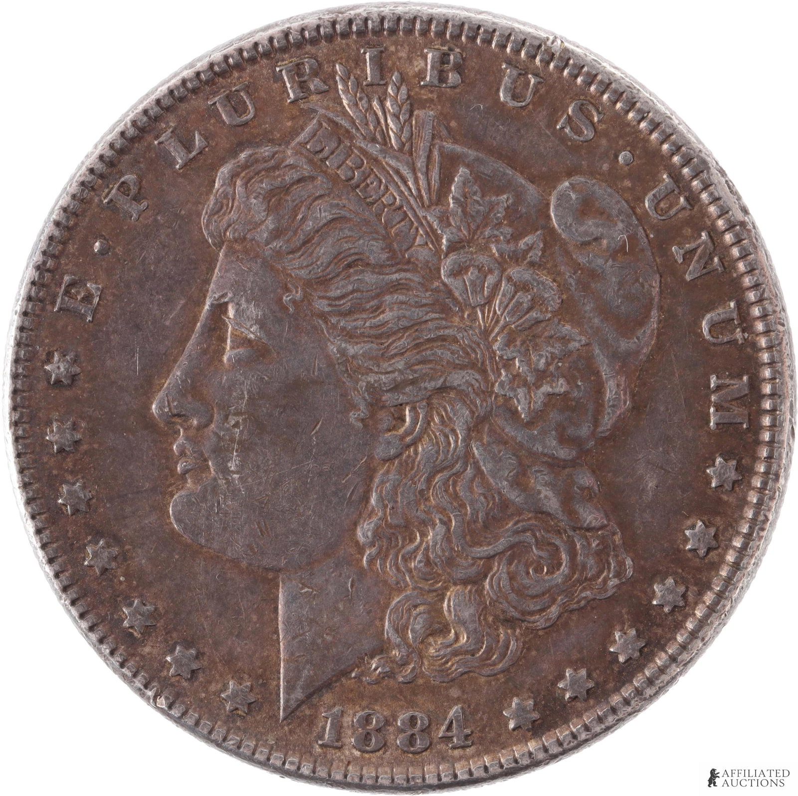 1884 Silver Morgan Dollar Circulation Quality: An 1884 silver Morgan dollar; no mint mark indicates Philadelphia mint. Heavily circulated with some oxidation; however, design is clearly visible and coin is overall in excellent condition. Metal: Si