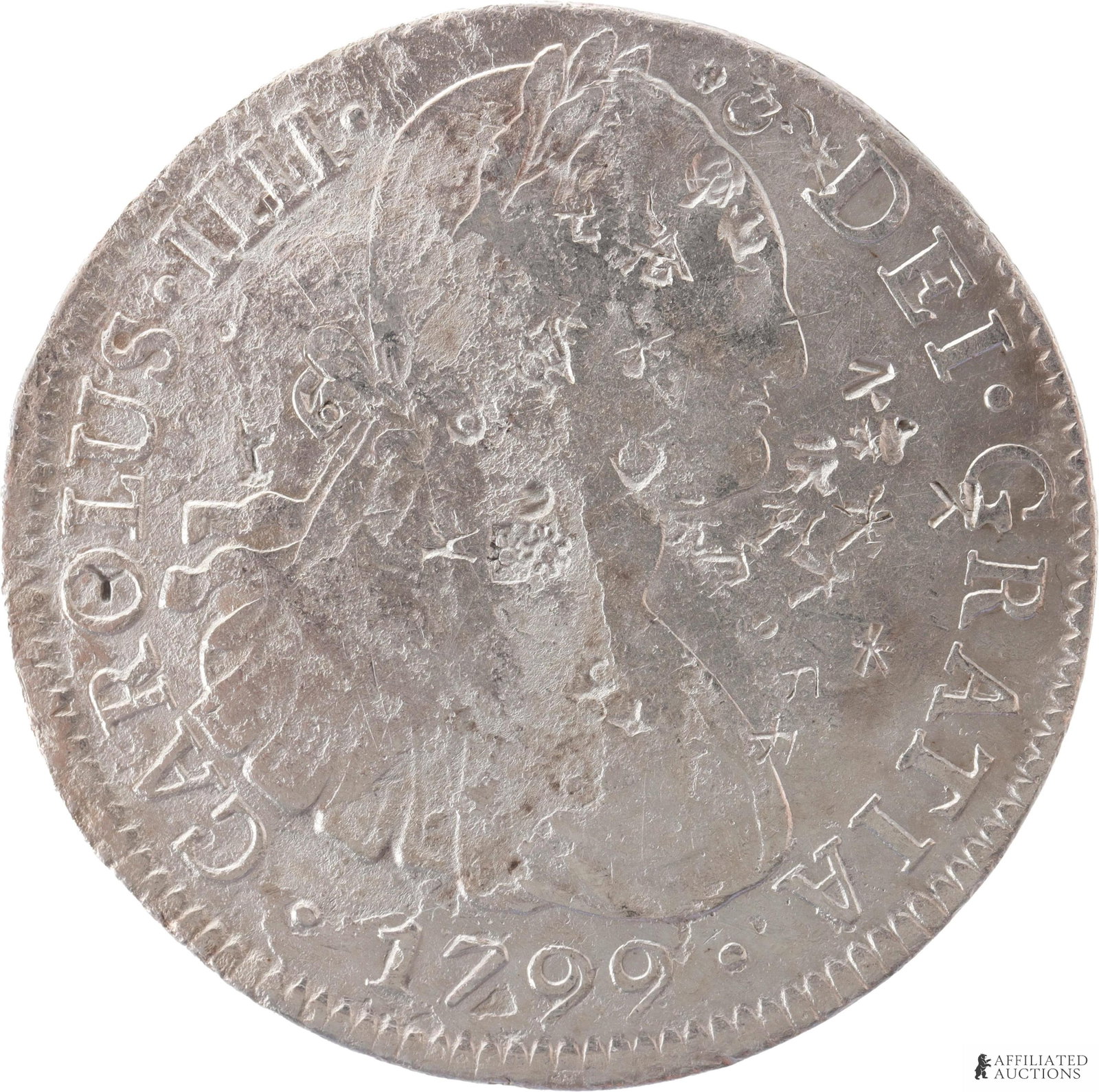 1799 Spanish 8 Reales Chop Mark Silver Coin: 1799 Spanish 8 Reales Charles IV Silver Coin Chop marks. Weight 27 grams. Diameter 39 mm. Obverse shows a bust facing right. Reverse shows the Hispanic arms. Metal: .896 Silver Country of Origin: Mexi