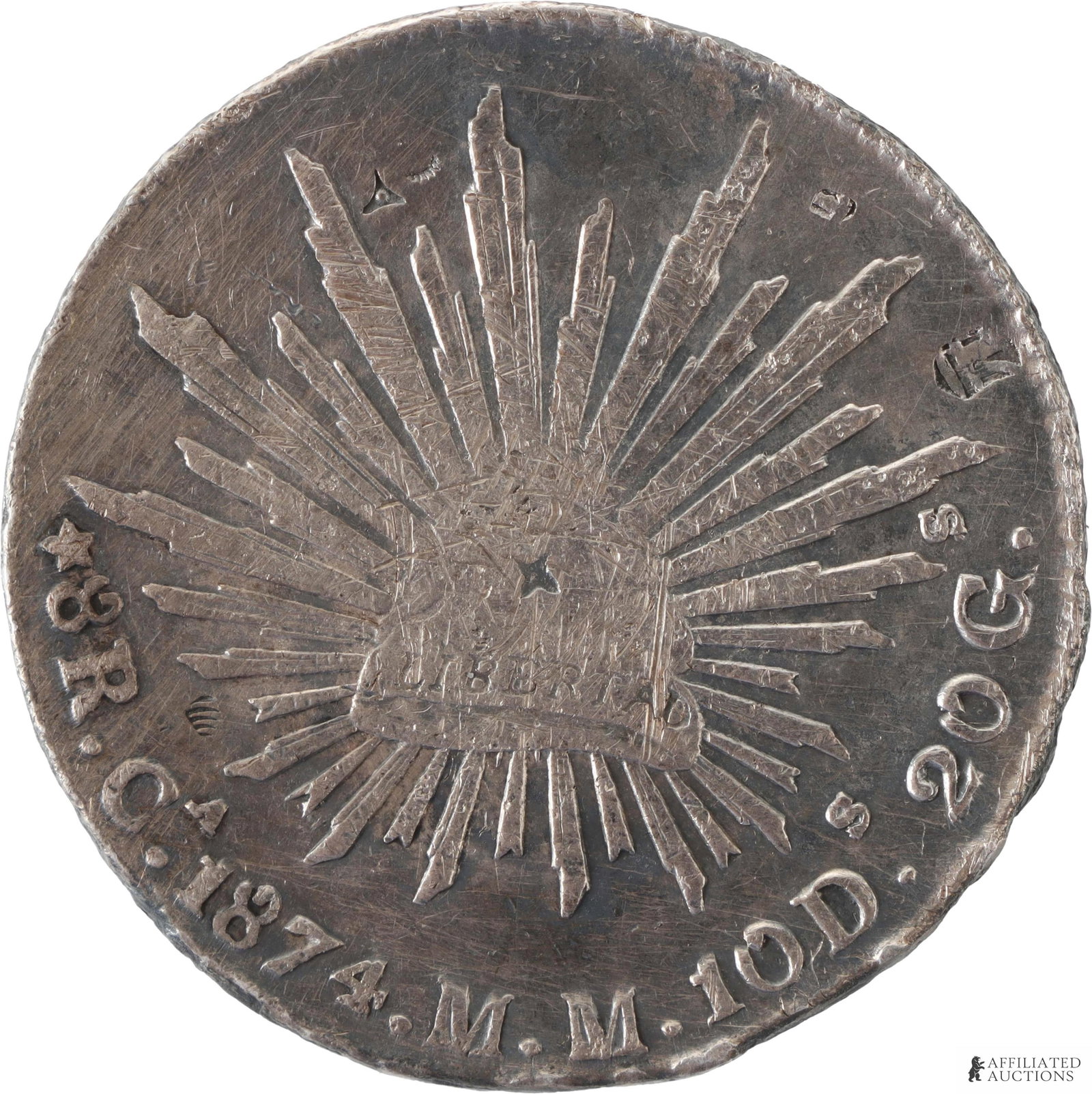 1874 8 Reales Mexico Silver Coin: 1874 8 Reales Mexico Silver Coin. Weight 27 grams. Diameter 33.7 millimeter. Obverse shows an eagle with snake on cactus. Reverse shows a radiant cap with rays. | Metal: .903 Silver Country of Origin: