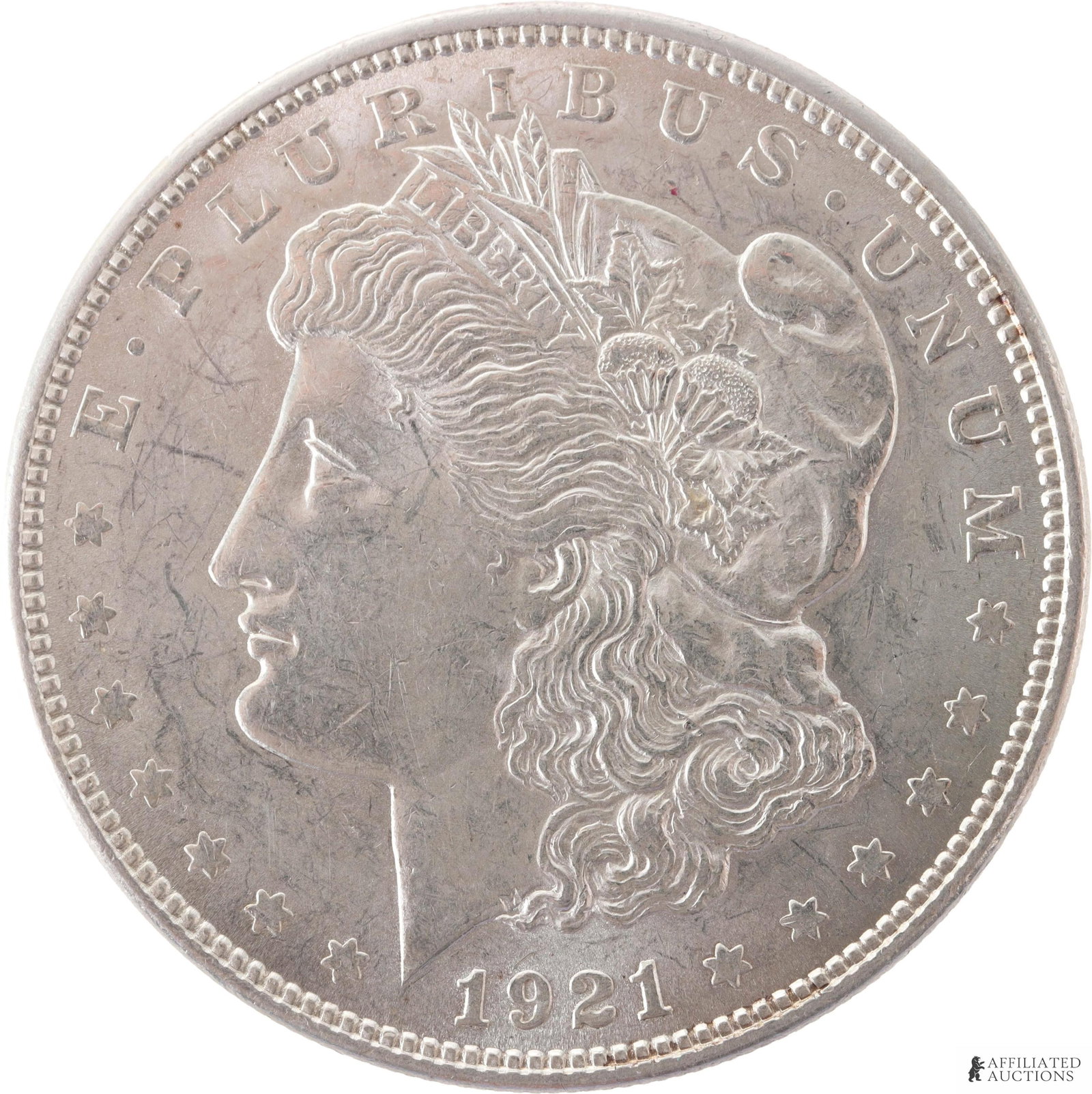 1921 Morgan Silver Dollar Mint Coin: 1921 Morgan Silver Dollar Coin. Obverse showing George T. Morgan's Profile of Lady Liberty. Reverse showing a Bald Eagle holding an Olive branch and Arrows. Metal: .900 Silver Country of Origin: Unite