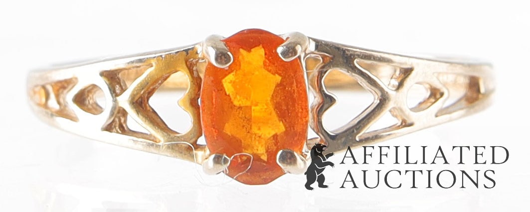 Cherry Opal Ring Size 6 10K Gold October Gemstone: A size 6 ring, 10K gold with '10KT' stamped inside band. Features a claw-set, red-orange cherry opal; opal is an October birthstone. The opal measures 5.95 x 5.93 x 3.05 mm, weighing approximately