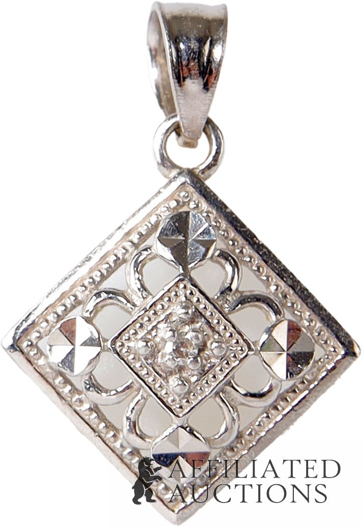 Vintage Diamond Pendant 10K White Gold April Gem: A necklace pendant featuring a round solitaire white diamond, prong-set in white gold (marked 10K on reverse); diamond is an April birthstone. Diamond measures 2.06 x 1.14 mm, weighing approximately 0