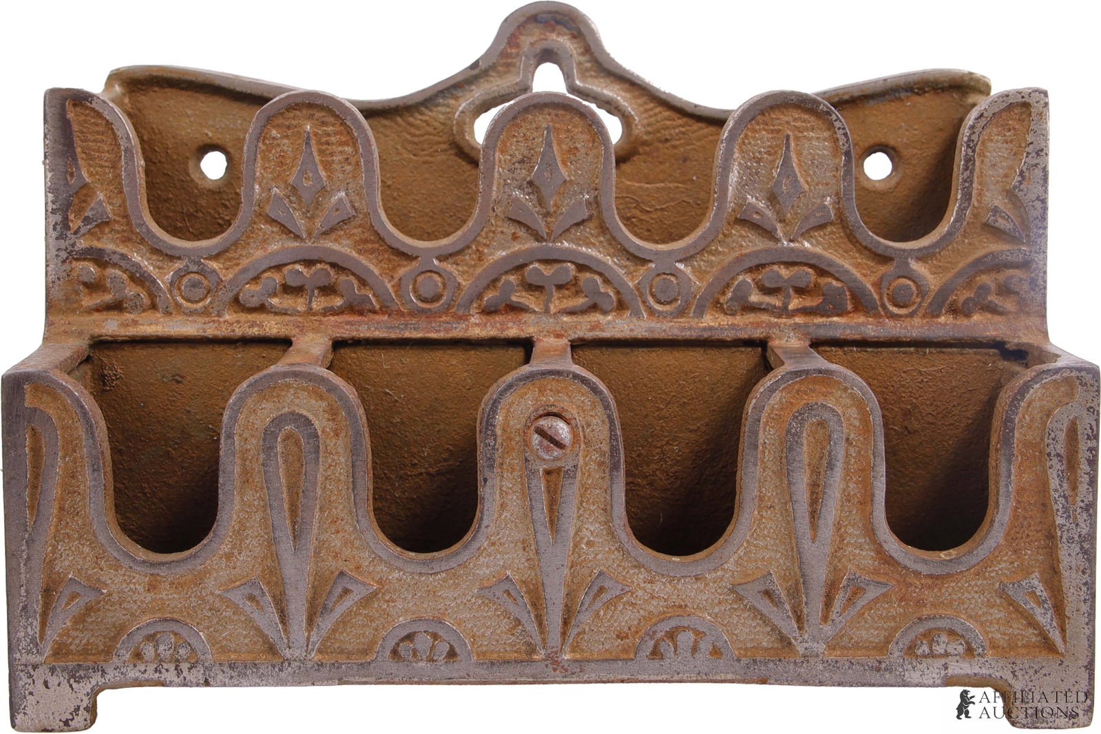 Cast Iron Koken Barbershop Token Holder: A cast iron barbershop token holder, used to organize pre-paid barbershop checks. This particular piece was manufactured by the Koken Barber Supply Company, features an ornate scrollwork design, and c