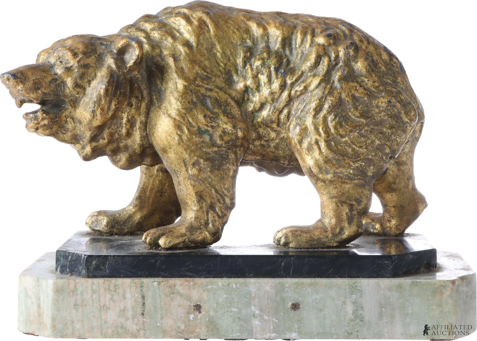 Vintage Tin Bear Statue on Stone Plinth: A tin bear statue with a gold-colored paint on a dual-level plinth. The bottom layer of the plinth is constructed of green marble or similar, while the top layer is black marble or similar; the statue