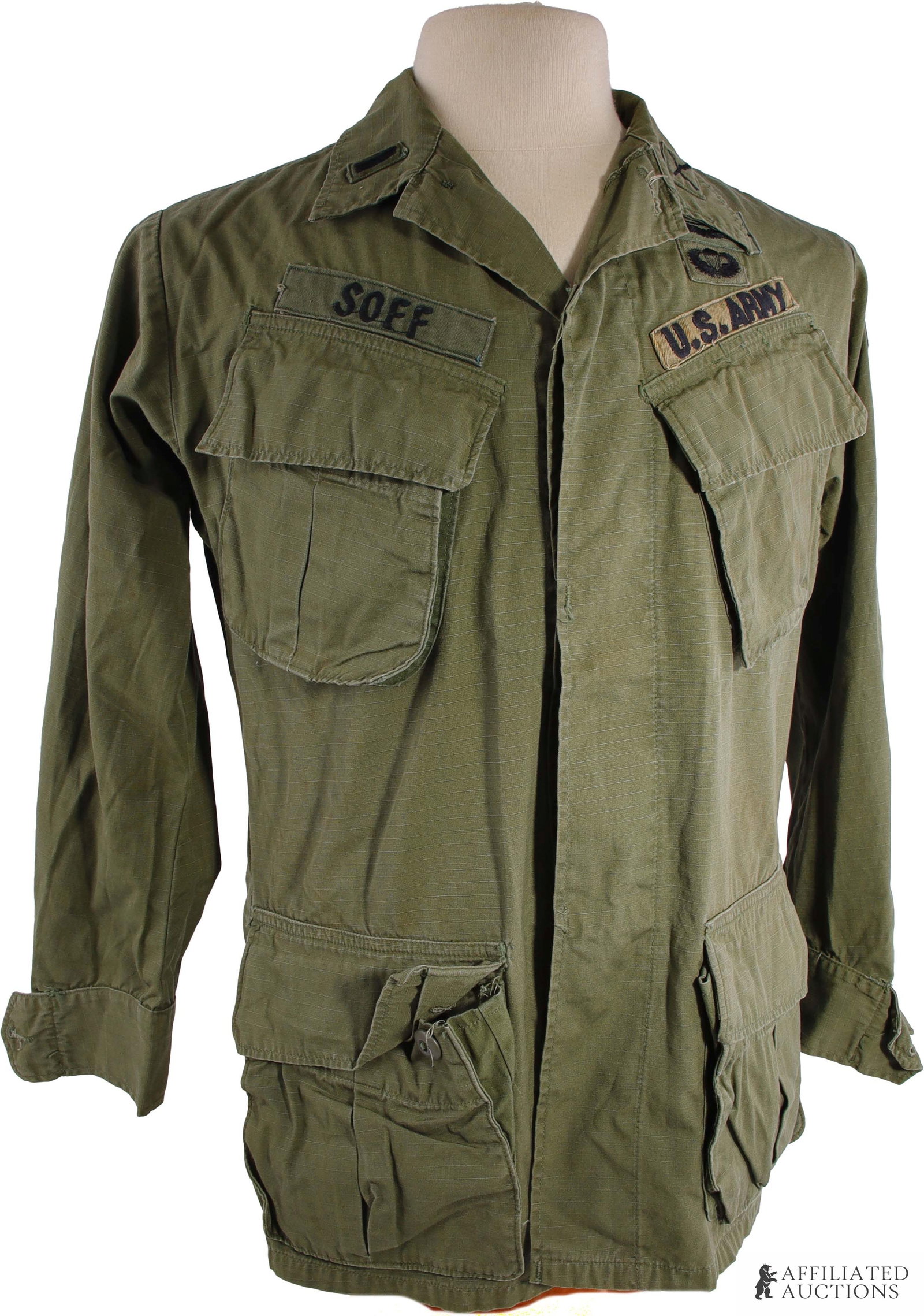 101st Airborne M64 Coat with Slanted Pockets Named: An M64 combat coat made of poplin ripstop, with appropriate patches and appearance. The jacket is named to Jeffrey Lee Soff, formerly of Tallahassee, Florida, who served as a platoon leader and Second