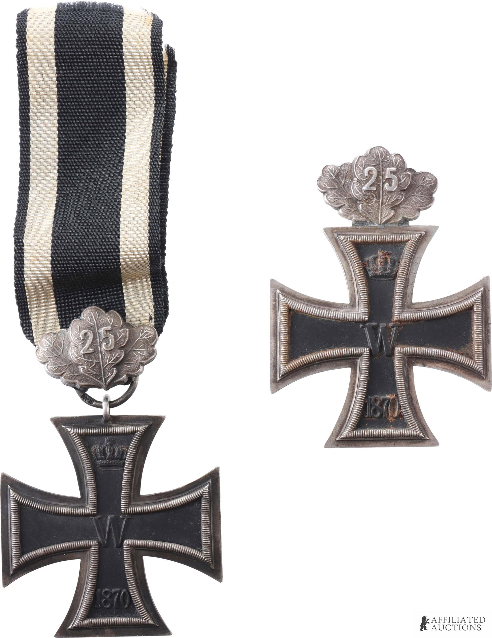 Cased 1870 Iron Cross 1st & 2nd Class Sy & Wagner: Cased set of two (2) pieces. Includes 1870 Iron Cross, I Class and 1870 Iron Cross, II Class, both with 25-year jubilee clip. I Class marked on wire pin "SW." Height 60mm. Width 43.58mm. II Class mark