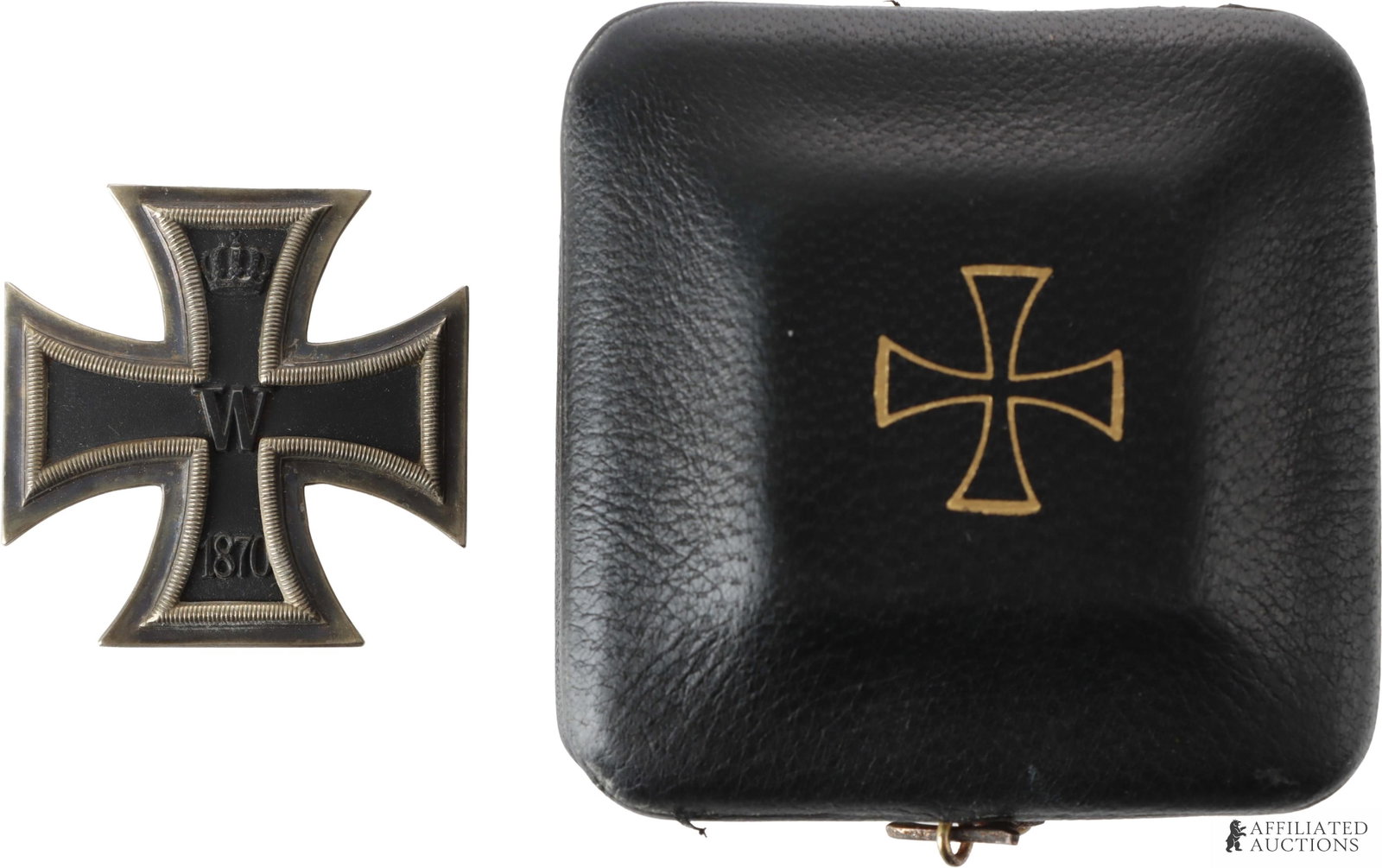 Cased 1870 Iron Cross First Class Imperial German: 1870 Iron Cross First Class in original case. Two piece frame with magnetic iron core. Maker is raised letters KMST and DRGM. Case measures 75mm. Medal measures 45mm. | This lot has a reserve.