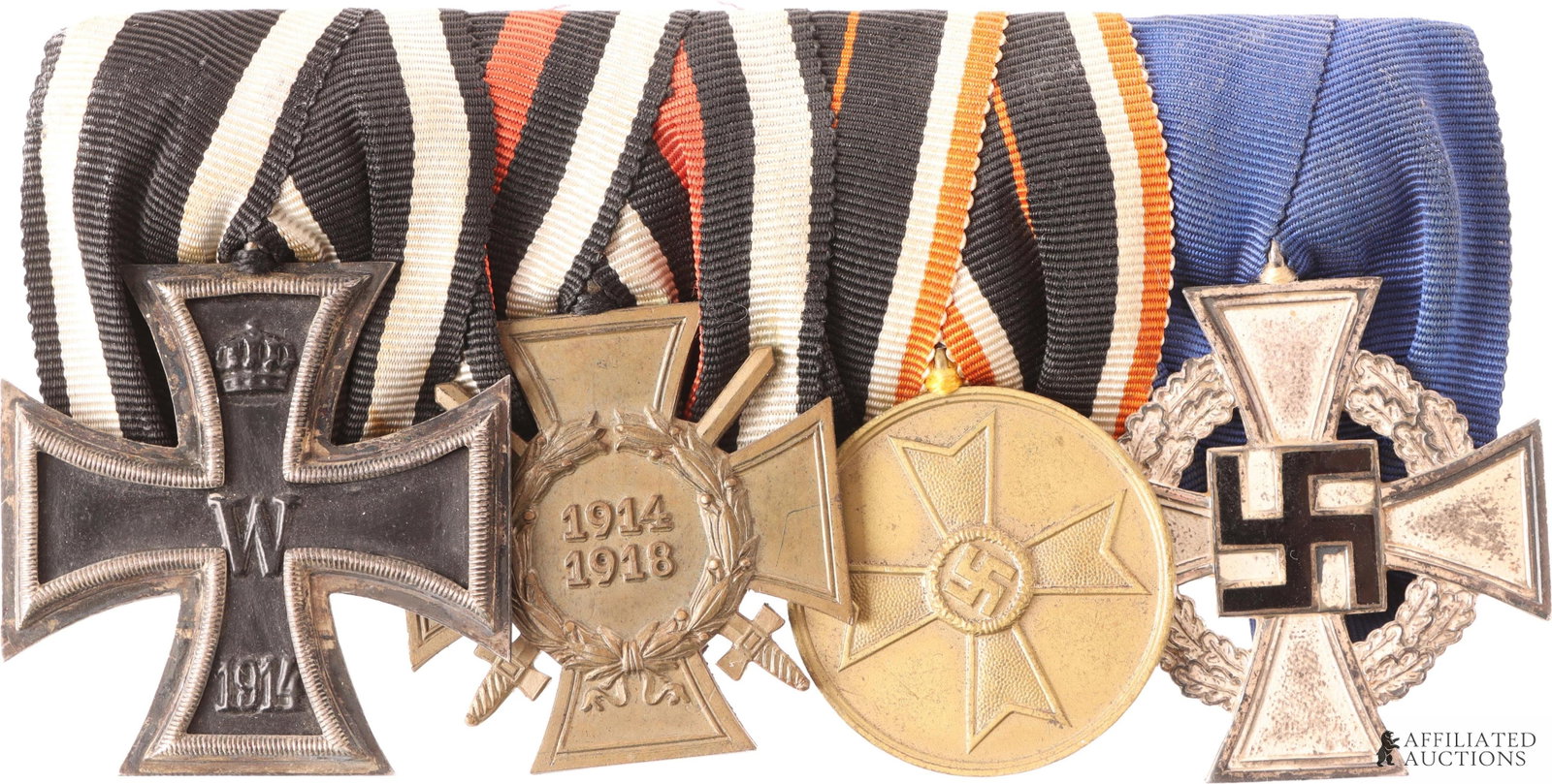 Four-Place Medal Bar WWI & Third Reich Otto Banse: Original four-place medal bar belonging to a German who served in the Great War and later in the Civil Service of the Third Reich. Mounted medals include a 1914 Iron Cross, 2nd Class, Hindenburg Cross