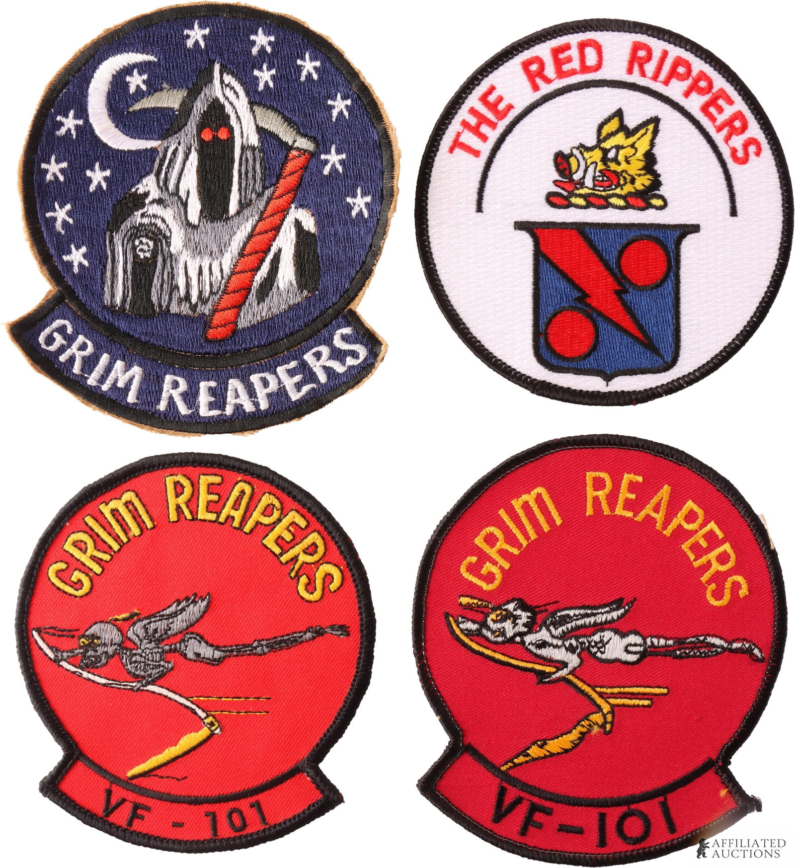 USN Strike Fighter Squadron Patches Lot of 4: A lot of four (4) United States Navy morale patches, including two (2) red variants of the Strike Fighter Squadron 101 (VFA-101, "Grim Reapers") insignia patch, one blue variant of the VF-101 patch, a