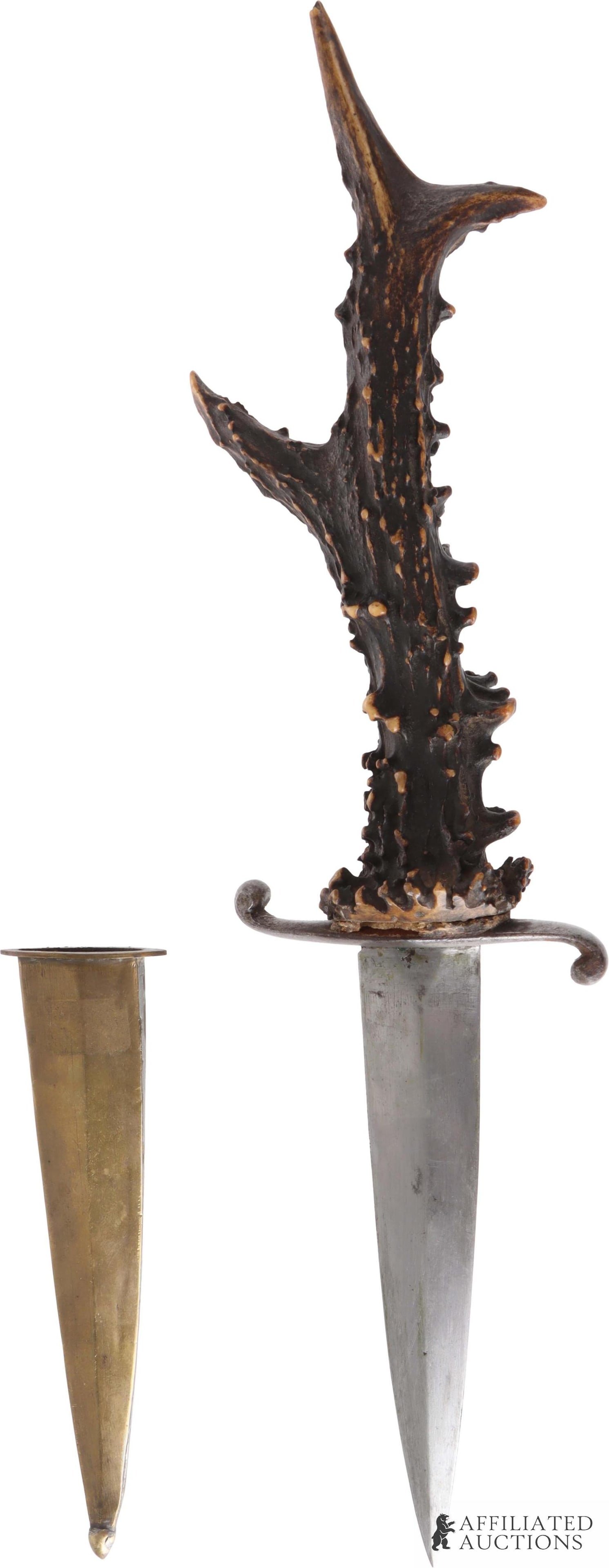 Antique Dagger S-Guard Antler Handle Brass Sheath: An antique dagger or dirk with a magnetic blade and S-guard; handle is crown stag, giving it a unique texture and appearance. The dagger comes with its original brass sheath. Overall length is approxi