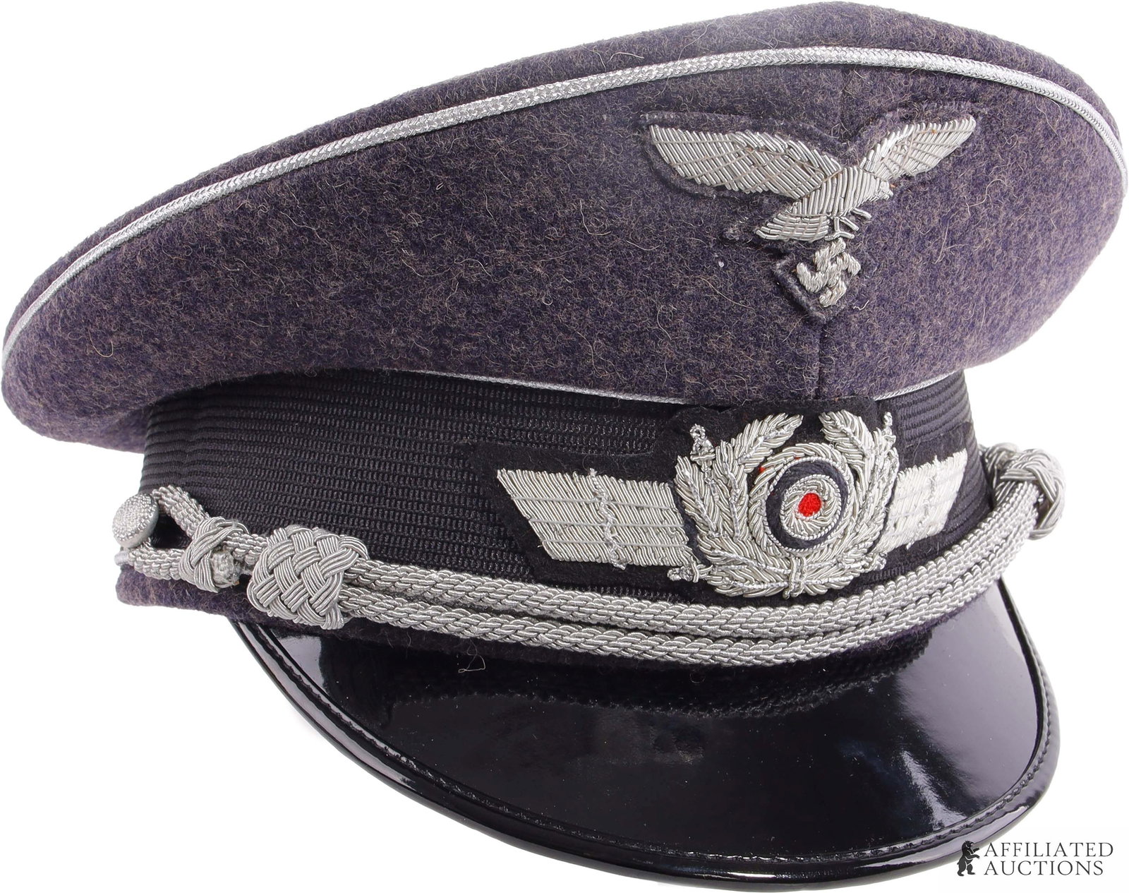 Luftwaffe Officers Visor Cap WWII German Reich: Historical interpreter's Luftwaffe officer visor cap. Silver bullion cockade, strap, and eagle, on a short wool construction with a ribbed ban and faux leather visor. Size 59.